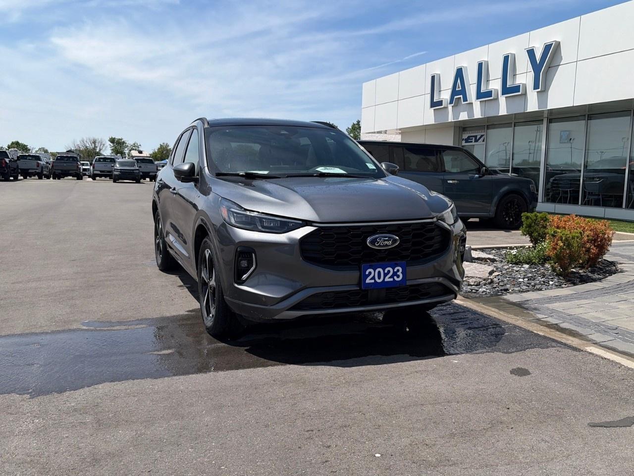 <p>The 2023 Ford Escape ST-Line Elite is a sporty, well-equipped compact SUV that combines athletic styling with upscale features and everyday practicality. Powered by a turbocharged 2.0-liter four-cylinder engine paired with an 8-speed automatic transmission, it delivers strong acceleration and confident performance. The ST-Line Elite trim includes distinctive sport-inspired exterior accents, leather-trimmed seating, a large digital instrument cluster, a premium audio system, advanced driver-assistance technologies, and a panoramic sunroof, offering a comfortable and technology-rich driving experience for drivers seeking both style and versatility.</p>