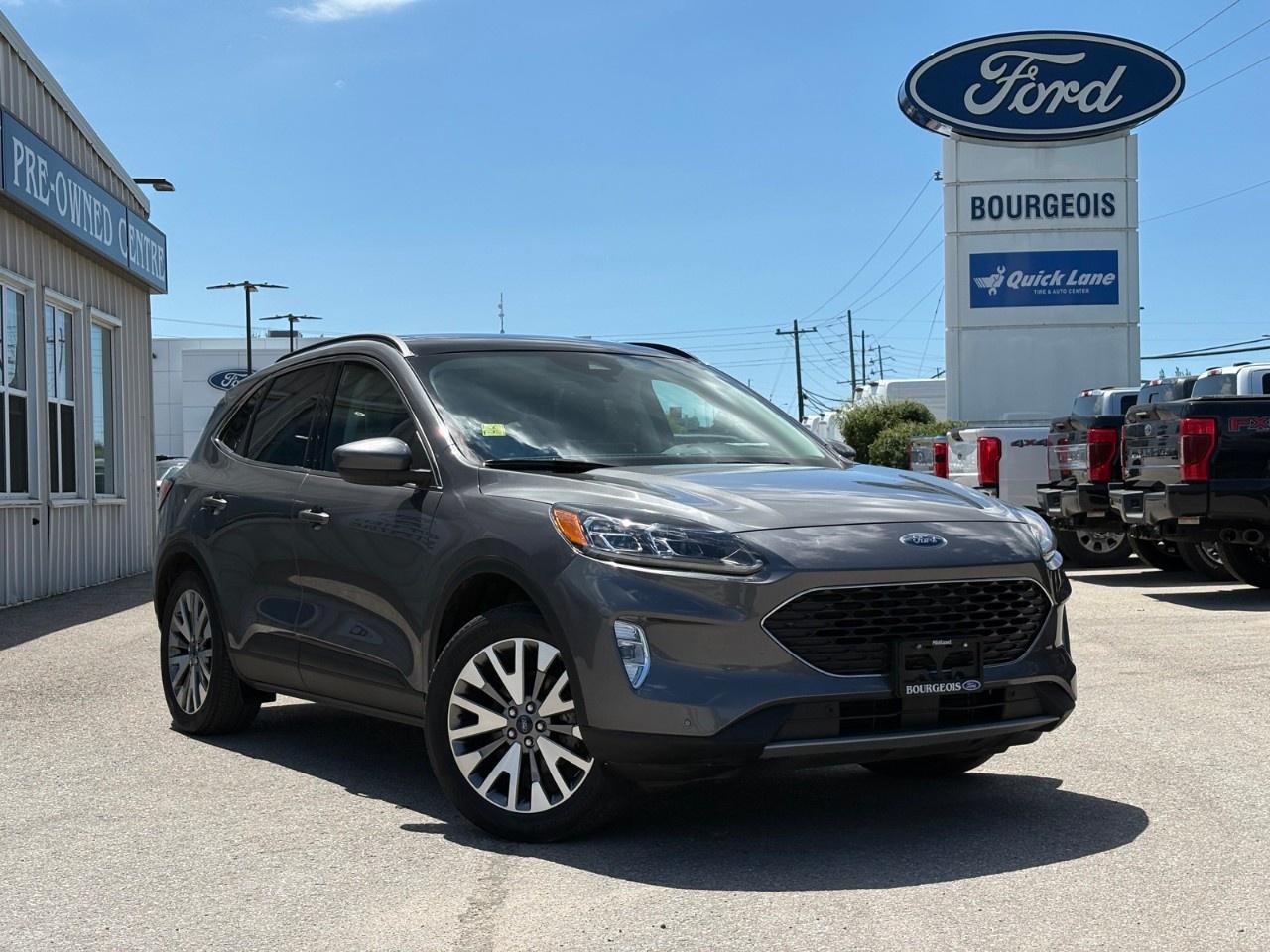 <p>Presenting the 2022 Ford Escape Titanium Hybrid in a sophisticated gray finish, equipped with all-wheel drive (AWD) for enhanced handling and stability. This SUV is tailored for those who desire a stylish yet practical option for every journey.</p><p>The exterior of the Escape is both robust and elegant, highlighted by its alloy wheels and modern design. Inside, you'll find a sleek black interior loaded with premium features designed for comfort and convenience, including heated seats, power windows, and a power seat adjustment for the driver.</p><p>Technologically advanced, this Escape comes with a navigation system, a user-friendly Bluetooth connection, and smart device integration ensuring you stay connected on the go. Safety features like a backup camera, lane assist, and parking sensors provide peace of mind, while the adaptive cruise control and brake assist enhance your driving experience.</p><p>Perfect for families or professionals seeking both efficiency and luxury, the 2022 Ford Escape Titanium Hybrid AWD is ready to impress. Contact Bourgeois Motors Ltd. today to schedule a test drive or to learn more about this exceptional SUV.</p> <p><strong>Why Choose the Bourgeois Auto Group?</strong></p><p>For 80 years, Bourgeois Auto Group has been delivering exceptional automotive experiences. Our factor trained teams work to ensure you receive the shopping experience you deserve; whether you're looking for a new or new-to-you vehicle.</p><p>Shop 24/7 with our online showroom and chat service, ensuring convenience every step of the way. No hidden fees, full disclosure, and every pre-owned vehicle comes with a Carfax® report for peace of mind.</p><p>We offer a wide selection of pre-owned vehicles, all competitively priced using real-time market data. Get the best deal on your purchase and trade-in with our free Live Market Analysis report.</p><p>Looking to sell your car? We buy any make or modelno purchase required. Our simple to use online trade valuation tool will provide you with a clear, transparent selling experience whether you buy our car or not.</p><p>Backed by hundreds dedicated employees across 4 convenient locations, were here to meet all your automotive needs. Visit us in Midland or Parry Sound and explore our inventory or schedule your next service today.</p> <p><strong>Financing Your Next Vehicle with Bourgeois Motors Ford in Midland:</strong></p><p>At Bourgeois Motors Ford, we make financing your next vehicle simple and stress-free! Our team works with trusted lenders to find flexible options tailored to your budget. Drive away with confidenceapply today!</p><p>Take advantage of our online pre-qualification tool, backed by Equifax and TD Bank to find the payment that works for you. Simply <a href=https://www.bourgeoismotors.com/free-credit-check/ rel=nofollow><strong>CLICK HERE</strong></a><strong> </strong>to use our secure online credit tool with no impact to your credit.</p>