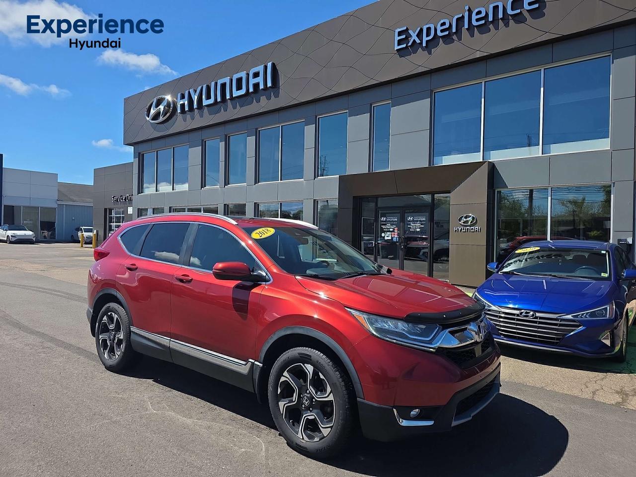 Awards:
  * Motor Trend Automobiles of the year   * 2018 KBB.com 10 Most Awarded Brands   * 2018 KBB.com Brand Image Awards

Red 2018 Honda CR-V Touring AWD CVT 1.5L I4 Turbocharged 

Fresh MVI Sticker, Clean Carfax Report 

18" Aluminum Alloy Wheels, Apple CarPlay, Auto-dimming Rear-View mirror, Exterior Parking Camera Rear, Forward collision: Collision Mitigation Braking System (CMBS) + FCW mitigation, Lane departure: Lane Keeping Assist System (LKAS) active, Memory seat, Power Liftgate, Power moonroof.<b> Were PEIs Premier Credit Specialists! Good poor, bad, or new credit? Divorced? Self-Employed? We have you covered! Our Credit Specialists are on standby 24/7 to help get you behind the wheel today! APPLY FOR YOUR PRE-APPROVAL TODAY - https://www.steeleadvantagefinancing.com/7182