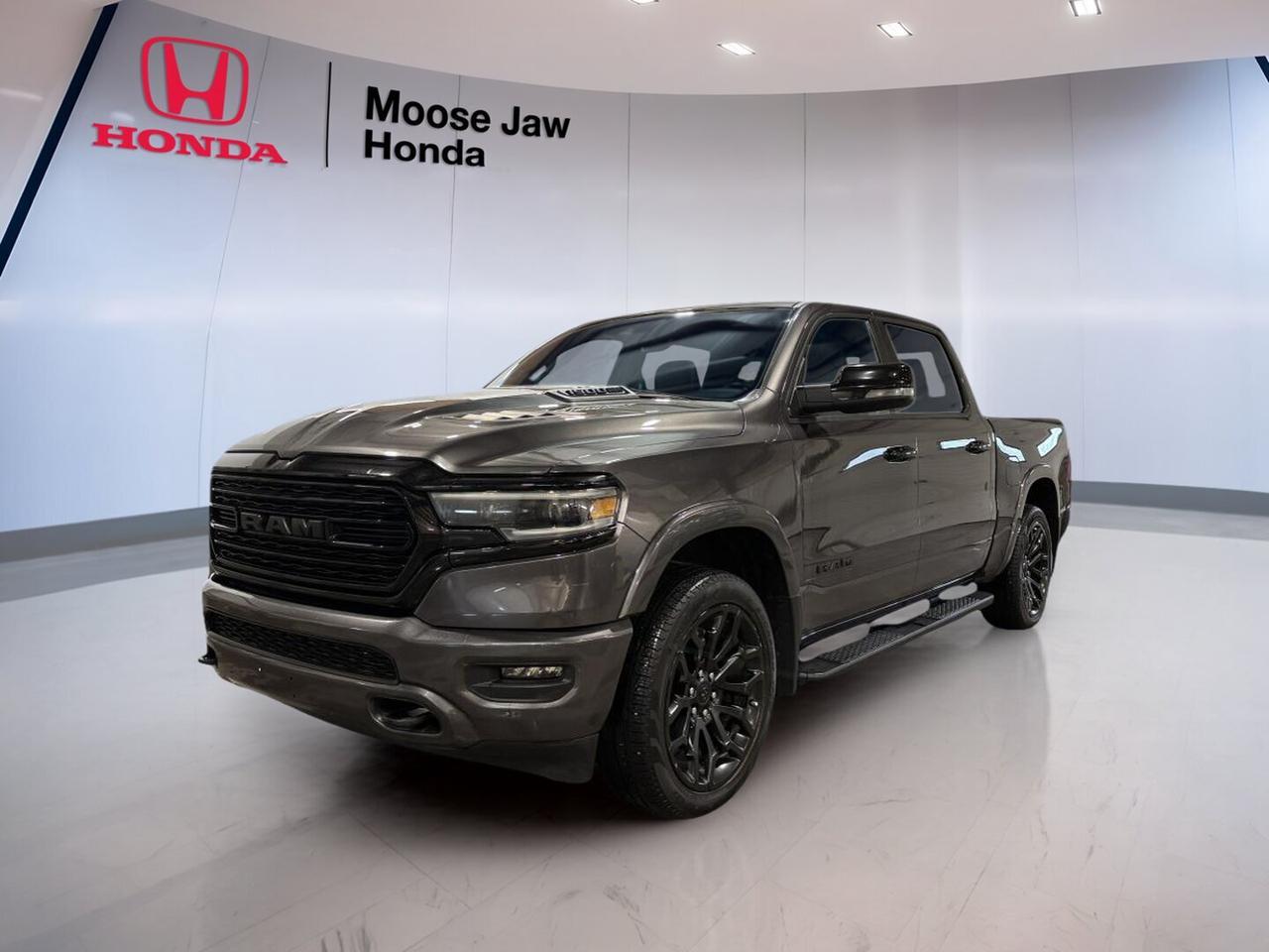 Built for drivers who want premium comfort and full-size truck strength, this 2024 RAM 1500 Limited delivers a refined ride with proven capability. CARFAX Canada reports no accident, giving you added confidence. Sold by Moose Jaw Honda in Moose Jaw, this used 2024 RAM 1500 Limited has 78,540 km and a smooth 8-speed automatic transmission.

Under the hood, the 2024 RAM 1500 Limited is powered by a 5.7L HEMI VVT V8 with MDS and eTorque. This setup brings strong passing power, confident highway performance, and extra support during everyday driving. With 4-wheel drive, this truck is ready for changing prairie weather, gravel roads, job sites, and weekend towing needs.

FEATURES OF THE 1500 Limited

»» Premium full-size truck with upscale feel
»» 5.7L HEMI V8 with eTorque system
»» Smooth-shifting 8-speed automatic transmission
»» Confident four-wheel drive capability included

TRUCK FEATURES

»» Strong towing capability for work duties
»» Four-wheel drive for added traction
»» Full-size bed supports daily hauling
»» Built for highway and jobsite comfort

ADVANCED SAFETY FEATURES

»» CARFAX Canada reports no accident history
»» Four-wheel drive adds road confidence
»» Strong braking support for heavy loads
»» Solid truck stance aids stability

PERFORMANCE AND EFFICIENCY

»» 5.7L HEMI V8 delivers strong power
»» eTorque system supports smoother acceleration
»» Eight-speed automatic shifts cleanly and quickly
»» MDS helps reduce fuel use

COMFORT AND CONVENIENCE

»» Spacious cabin for daily driving comfort
»» Refined ride quality for a truck
»» Easy highway cruising over long distances
»» Premium trim adds upscale ambience

TECHNOLOGY AND CONNECTIVITY

»» Driver-focused controls are easy to reach
»» Clear display layout supports daily use
»» Modern cabin design feels intuitive
»» Useful infotainment features enhance convenience

CARGO SPACE

»» Full-size bed handles large cargo
»» Cabin offers room for personal gear
»» Flexible space for workday essentials
»» Ideal for tools and weekend loads

AWARDS & RECOGNITIONS

»» Best Full-Size Light-Duty Pickup, AutoTrader Awards, 2024

WHAT OTHER OWNERS LIKE

»» Smooth ride for a full-size truck
»» Strong HEMI V8 power delivery
»» Quiet cabin on longer drives
»» Comfortable interior for daily use

This used truck blends upscale comfort with real V8 performance, making it a smart choice for drivers who need more than basic pickup ability. The 2024 RAM 1500 Limited stands out with its balanced ride, confident 4-wheel drive traction, and strong road presence, while still feeling easy to live with every day.

Whether you need a truck for towing, hauling, commuting, or travel, this 2024 RAM 1500 Limited is ready to deliver. Its premium character, capable drivetrain, and no-accident CARFAX Canada report make it an appealing option for buyers who want strength and refinement in one well-rounded package.

This 2024 RAM 1500 Limiteds VIN is: 1C6SRFHT7RN121700.