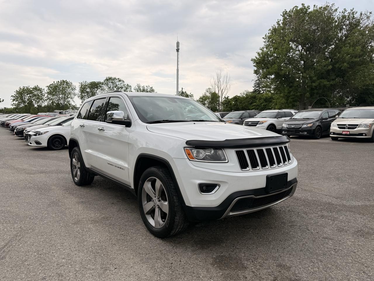 <p>Experience the perfect blend of rugged capability and refined comfort with this pre-owned 2014 Jeep Grand Cherokee Limited, now available at Target Auto Centre. Dressed in a classic white exterior with a welcoming beige interior, this SUV is ready to take on your daily commute or your next great adventure. Under the hood, a robust 3.6L V6 engine paired with a smooth automatic transmission and legendary 4-wheel drive system ensures you have the power and confidence to tackle any road condition Canada throws your way. With only 173,971 km on the odometer and a clean CARFAX report, this Grand Cherokee Limited represents a fantastic opportunity to own a capable and well-appointed vehicle.&nbsp;This 2014 Jeep Grand Cherokee Limited is more than just transportation; its a statement of style and functionality. The Limited trim level offers a premium experience, making every drive a pleasure. Its versatile SUV/Crossover body style provides ample space for passengers and cargo, while the Flex Fuel capability offers an extra layer of convenience. Whether youre navigating city streets or venturing off the beaten path, this Jeep Grand Cherokee is engineered to impress.</p><p>&nbsp;</p><hr><p>&nbsp;</p><p dir=ltr><strong>CERTIFIED PRE-OWNED VEHICLE | BUY WITH CONFIDENCE</strong></p><p dir=ltr>&nbsp;- Ontario Safety Standards Certificate Included<br>- 30 Day / 1,000 KM Safety Warranty Included<br>- Fully Detailed Prior to Delivery<br>- CARFAX Vehicle History Report Available</p><p>&nbsp;</p><hr><p>&nbsp;</p><p dir=ltr><strong>VALUE AND TRANSPARENCY | WHY CHOOSE US</strong></p><p dir=ltr>- Price Plus HST & Licensing Only<br>- No Additional Fees | All-In Pricing<br>- Same Price Cash or Finance<br>- Extended Warranty Protection Plans Available<br>- Autotrader Best Priced Dealer Award (2024)<br>- Competitive Market Value on Trade-ins<br>- We&rsquo;ll Buy Your Car &mdash; No Purchase Required<br>- Know Someone Looking For a Vehicle? Get a Referral Award<br>- Open 7 Days a Week</p><p>&nbsp;</p><hr><p>&nbsp;</p><p dir=ltr><strong>ABOUT TARGET AUTO CENTRE</strong></p><p dir=ltr>Target Auto Centre has been proudly serving London, Ontario and surrounding areas for over 20 years, offering over 150 quality pre-owned vehicles and a constantly updated selection to choose from. We focus on providing competitive pricing, clear information, and a straightforward buying process so you know exactly what to expect from start to finish.</p><p dir=ltr>Cars For Everyone! We offer a wide selection of vehicles to fit every lifestyle, need, and budget. Our inventory includes cars, trucks, SUVs, and vans from trusted brands such as Ford, Chevrolet, Toyota, Honda, Nissan, BMW, Mercedes-Benz, Audi, Lexus, Acura, Hyundai, Kia, Mazda, Volkswagen, Jeep, RAM, GMC, Subaru, and more. With new arrivals regularly, there&rsquo;s always something for everyone.</p><p dir=ltr>As a proud member of the Used Car Dealers Association of Ontario (UCDA), we are committed to operating with honesty, transparency, and professionalism in every transaction. Our goal is to make your vehicle purchase as simple and stress-free as possible, while delivering the level of service our customers continue to trust. Come visit us today and see why were the preferred choice for pre-owned vehicles in London and the surrounding areas. We look forward to earning your business!</p>