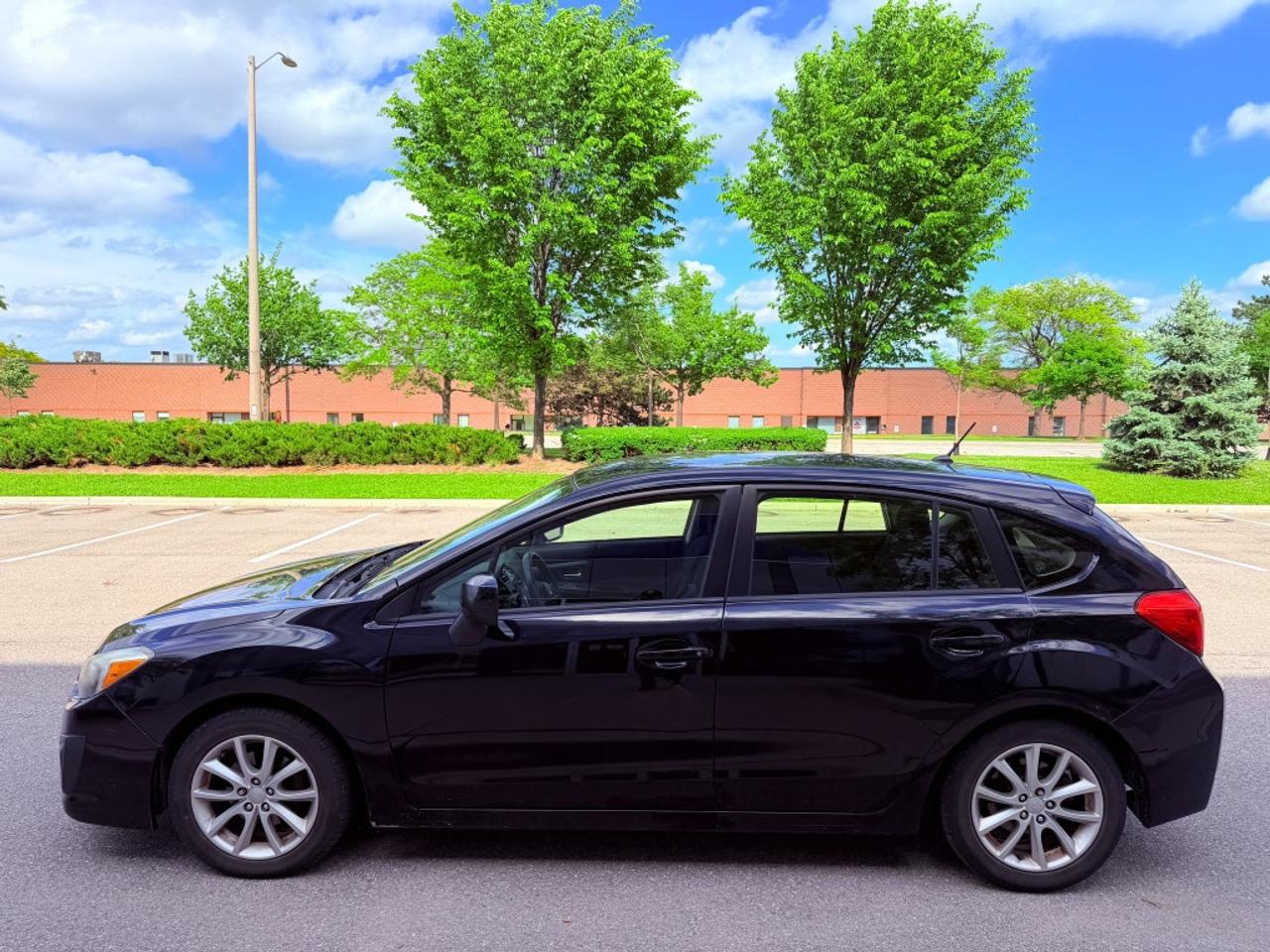2013 Subaru Impreza 4dr Sedan  2.0i w/Touring Pkg Photo