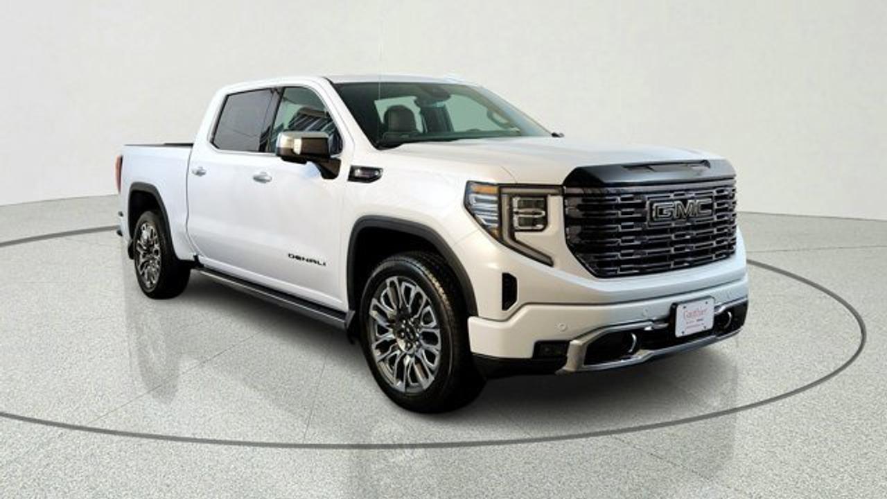 The 2026 GMC Sierra 1500 Denali Ultimate represents the pinnacle of GMC luxury and capability, combining a premium interior with authentic open-pore wood, full-grain leather seating, and advanced technology throughout the cabin. It delivers impressive performance with powerful engine options, sophisticated towing features, and Super Cruise hands-free driver assistance technology for enhanced confidence on the road. Distinctive Vader Chrome accents, exclusive Denali Ultimate badging, and a premium MultiPro Tailgate complete this upscale full-size pickups refined and commanding presence.