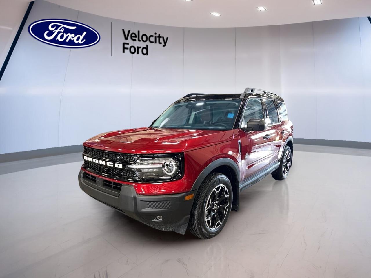 Built for Canadian roads and daily ease, the brand new 2026 Ford Bronco Sport Outer Banks 4x4 at Velocity Ford in Moose Jaw blends rugged confidence with smart comfort. Its red exterior and black interior give it a bold, upscale look, while four doors and an automatic transmission make every trip simple.

The 2026 Ford Bronco Sport Outer Banks 4x4 uses a 1.5-litre unleaded engine paired with an 8-speed automatic transmission. With four-wheel drive, heated features, and modern driver aids, it is ready for changing weather, city errands, and weekend travel with the practicality SUV drivers want.

FEATURES OF THE Bronco Sport Outer Banks 4x4
»» Red exterior with confident SUV presence
»» Four-wheel drive for all-season traction
»» 1.5-litre engine with automatic shifting
»» Heated comfort for cold Canadian mornings

ADVANCED SAFETY FEATURES
»» Backup camera helps with safer reversing
»» Blind spot monitor adds lane awareness
»» Lane departure warning supports safer travel
»» Multiple airbags help protect occupants

PERFORMANCE AND EFFICIENCY
»» 1.5-litre unleaded engine balances daily efficiency
»» Eight-speed automatic supports smooth acceleration
»» Four-wheel drive boosts traction on roads
»» Power steering adds easy urban handling

COMFORT AND CONVENIENCE
»» Heated front seats add winter comfort
»» Dual-zone climate control manages cabin temperature
»» Remote starter helps before you enter
»» Power seats support daily driving comfort

TECHNOLOGY AND CONNECTIVITY
»» Bluetooth integration supports hands-free phone use
»» WiFi hotspot helps keep devices connected
»» Satellite radio expands entertainment choices
»» Steering wheel audio controls simplify access

CARGO SPACE
»» Rear trunk access makes loading easier
»» Four-door layout helps passenger entry
»» Flexible SUV space suits daily errands
»» Rear area handles gear and groceries

WHAT OTHER OWNERS LIKE
»» Easy-to-drive size for city use
»» Useful all-wheel confidence in poor weather
»» Comfortable heated features for winter driving
»» Practical cargo room for active lifestyles

This brand new SUV also includes useful everyday details that add value. Heated mirrors, electric mirrors, power windows, tinted windows, automatic headlights, fog lights, a rear window defroster, push button start, memory seats, memory mirrors, and an auto-dimming rearview mirror all help make daily driving easier.

Inside, the 2026 Ford Bronco Sport Outer Banks 4x4 keeps things simple and functional. Front air conditioning, automatic climate control, an adjustable steering wheel, driver lumbar support, illuminated vanity mirrors, automatic door locks, tire pressure monitoring, and passenger airbag sensing all work together to support comfort and peace of mind.

This new SUV is a smart fit for drivers who want modern safety, useful technology, and true year-round capability. Available now at Velocity Ford in Moose Jaw, the 2026 Ford Bronco Sport Outer Banks 4x4 delivers a confident mix of comfort, traction, and versatility for life in Saskatchewan.

This 2026 Ford Bronco Sport Outer Banks 4x4s VIN is: 3FMCR9CN2TRE68844.