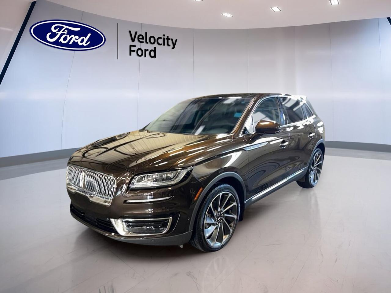 Enjoy refined comfort and confident power in this 2019 Lincoln Nautilus Reserve AWD, now available at Velocity Ford in Moose Jaw. Finished in Brown with a Brown interior, this used luxury SUV shows only 31,454 km. Its 2.7-litre unleaded engine and 8-speed automatic transmission deliver smooth, assured performance for daily driving and long highway trips.

With four doors, premium styling, and a well-equipped cabin, this 2019 Lincoln Nautilus Reserve AWD blends upscale comfort with practical versatility. Features such as the panoramic sunroof, navigation system, heated front and rear seats, power liftgate, and advanced driver-assist technologies help make every drive more relaxing and rewarding.

FEATURES OF THE Nautilus Reserve AWD

»» 2.7-litre turbocharged V6 delivers strong power
»» All-wheel drive adds year-round confidence
»» Panoramic sunroof brightens the premium cabin
»» Navigation system supports easy trip planning

ADVANCED SAFETY FEATURES

»» Backup camera helps with safer reversing
»» Blind spot monitor supports lane awareness
»» Lane departure warning adds extra confidence
»» Multiple airbags enhance occupant protection

PERFORMANCE AND EFFICIENCY

»» 2.7-litre engine offers smooth, strong acceleration
»» 8-speed automatic enables refined shifting
»» All-wheel drive improves traction in Canada
»» Stability control supports composed road manners

COMFORT AND CONVENIENCE

»» Heated front seats improve cold mornings
»» Heated rear seats add passenger comfort
»» Dual-zone climate control keeps balance
»» Remote starter helps pre-condition the cabin

TECHNOLOGY AND CONNECTIVITY

»» Navigation system provides clear route guidance
»» Bluetooth integration supports hands-free calling
»» WiFi hotspot keeps devices better connected
»» Steering wheel audio controls add ease

CARGO SPACE

»» Power liftgate makes loading more convenient
»» Rear trunk access improves daily usability
»» Four-door layout supports family versatility
»» Spacious rear area handles travel gear

AWARDS & RECOGNITIONS

»» Top Safety Pick, Insurance Institute for Highway Safety, 2019

WHAT OTHER OWNERS LIKE

»» Quiet ride and smooth highway comfort
»» Strong turbocharged power for easy passing
»» Premium cabin feel and upscale design
»» User-friendly technology and helpful safety features

This 2019 Lincoln Nautilus Reserve AWD stands out with thoughtful equipment that adds comfort and convenience every day. Included features such as cruise control, power steering, ABS, automatic headlights, fog lights, heated mirrors, retractable mirrors, power windows, push button start, memory seats, memory mirrors, adjustable suspension, tinted windows, satellite radio, HD Radio, and an auto-dimming rearview mirror help create a polished ownership experience.

This 2019 Lincoln Nautilus Reserve AWD also offers practical luxury for Canadian driving. The rear window defroster, tire pressure monitoring system, child safety locks, passenger airbag sensor, illuminated vanity mirrors, spare tire, and performance tires all support peace of mind. At Velocity Ford in Moose Jaw, this well-kept luxury SUV is ready to deliver premium comfort, advanced technology, and capable all-weather confidence.

This 2019 Lincoln Nautilus Reserve AWDs VIN is: 2LMPJ8LP9KBL51560 .