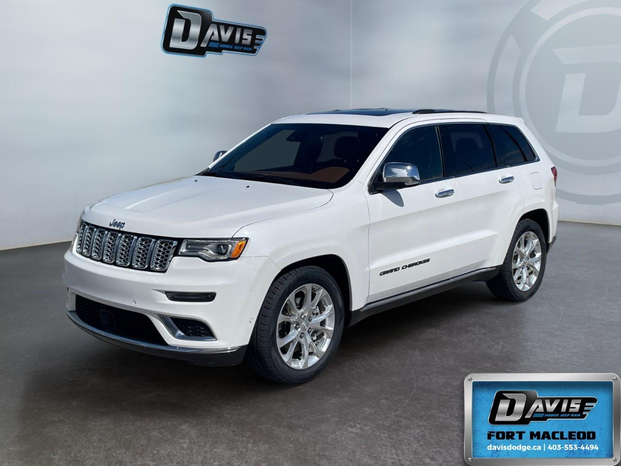 <p><strong>2021 Jeep Grand Cherokee Summit 4x4</strong><br />Color: White<br />Drivetrain: 4×4</p> <p>The 2021 Jeep Grand Cherokee Summit 4x4 in striking White is a robust SUV designed for both city roads and adventurous terrains.</p> <p><strong>Interior Features:</strong></p> <ul><li>Luxurious Brown leather seats - both heated and cooled for your comfort</li><li>Remote start and dual-zone air conditioning ensuring a pleasant cabin climate at all times</li><li>Spacious interior with power-adjustable seats, leather-wrapped steering wheel and gear shifter</li><li>Stunning dark sienna brown and black interior accents complemented by piano black and aluminum trim</li></ul> <p><strong>Exterior Features:</strong></p> <ul><li>Classic SUV silhouette with 20" fully polished aluminum wheels</li><li>Ivory Tri-Coat Pearl exterior for a touch of elegance</li><li>Convenience of heated power mirrors</li></ul> <p><strong>Technology & Safety Features:</strong></p> <ul><li>State-of-the-art navigation system with smart device integration for seamless connectivity</li><li>Advanced Quadra-Drive II 4X4 System for exceptional off-road performance</li><li>Automatic parking, lane assist, and adaptive cruise control for enhanced driver assistance</li><li>Top-tier safety with parking sensors, brake assist, and a backup camera</li><li>Wi-Fi hotspot and satellite radio keeping you connected and entertained on the go</li></ul> <p>If you are someone who values luxury and rugged capability in an SUV, the 2021 Jeep Grand Cherokee Summit 4x4 is tailor-made for you. Don't miss out on this perfect combination of style, comfort, and technology. Contact <strong>Davis Dodge Fort Macleod</strong> today for more details!</p>