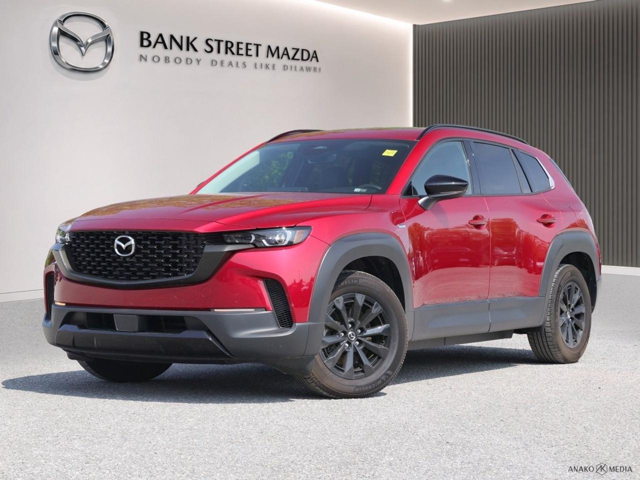 Introducing the stunning 2025 Mazda CX-50 Hybrid Kuro e-AWD, a vibrant red SUV engineered for exceptional performance with its smooth automatic transmission and versatile AWD drivetrain. Its captivating exterior exudes confidence, making a powerful impression on the road. Step inside to experience a thoughtfully designed interior, where elegance and comfort meet. With heated seats and power-adjustable options, every journey becomes a delight. The alloy wheels add an extra touch of sophistication, while the sunroof/moonroof invites the open sky into your travels. This Mazda CX-50 Hybrid is equipped with advanced technology features, including smart device integration and a Wi-Fi hotspot, ensuring you stay connected wherever you go. Enjoy peace of mind with safety features such as lane assist and brake assist, along with the convenience of a backup camera and cruise control for effortless driving. This SUV is perfect for families and tech-savvy individuals who require both style and practicality in their daily drive. Contact Bank Street Mazda today to schedule a test drive and experience the 2025 Mazda CX-50 Hybrid Kuro e-AWD for yourself!