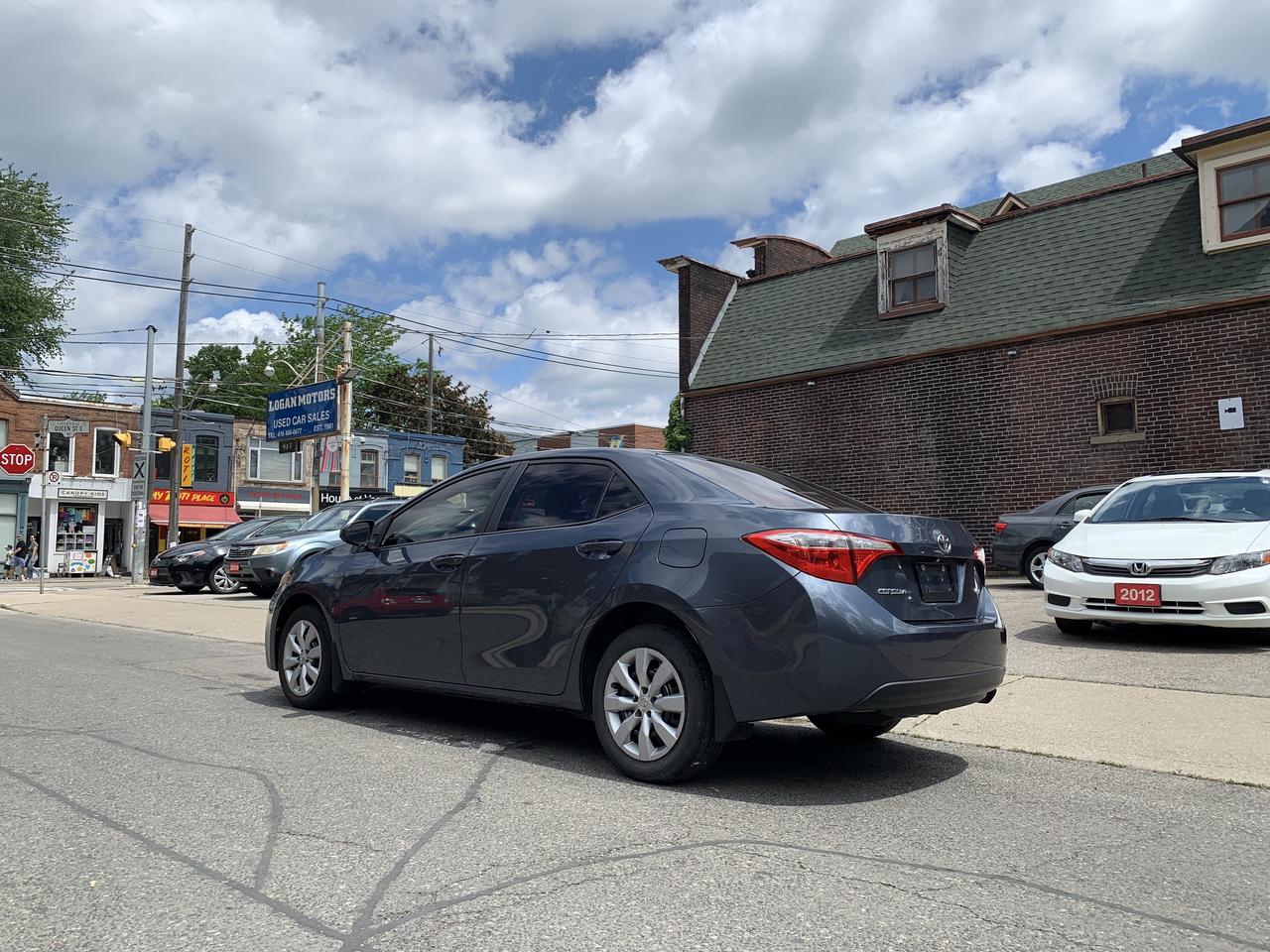 2014 Toyota Corolla 4dr Sdn CVT LE Photo