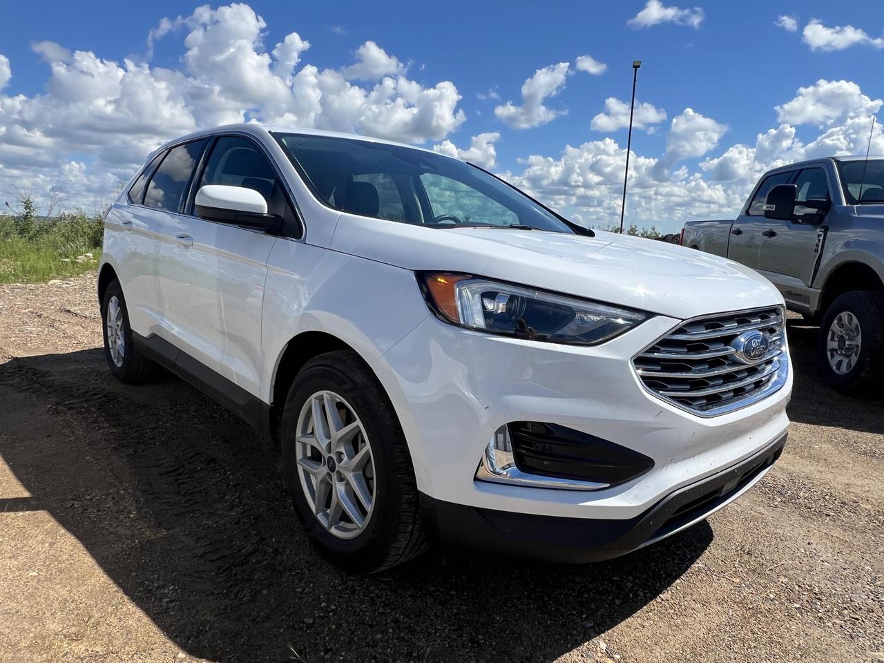 If youre looking for a capable, tech-forward SUV that works as hard as you do, this 2022 Ford Edge SEL in Oxford White deserves your attention. With under 70,000 km on the clock, AWD capability, and a long list of driver-assist and convenience features, this Edge hits a sweet spot for families and commuters who want substance over flash.

Key Highlights:
- 2.0L EcoBoost engine paired with AWD and automatic transmission  confident performance in all conditions
- Ford Co-Pilot360 suite including Blind Spot Information System (BLIS) and Cross-Traffic Alert for confident, aware driving
- Leather/metal-look steering wheel with voice activation and dual-zone automatic climate control for a refined daily experience
- Power liftgate for hands-free rear cargo access  a genuine everyday convenience
- FordPass Connect 4G Mobile Hotspot keeps passengers connected on the go
- Auto-dimming rearview mirror, auto high-beam LED headlamps, and rain-sensing wipers  thoughtful details that reduce driver fatigue
- Rear parking sensors and backup camera with washer for added confidence in tight spaces
- MyKey system with programmable safety settings  great for households with newer drivers

Merit Ford Sales is here to make the next step easy. Whether youd like to reserve this vehicle, start your purchase online, or simply book a test drive to experience it for yourself, our team is ready to help. Reach out with any questions  were happy to walk you through your options.