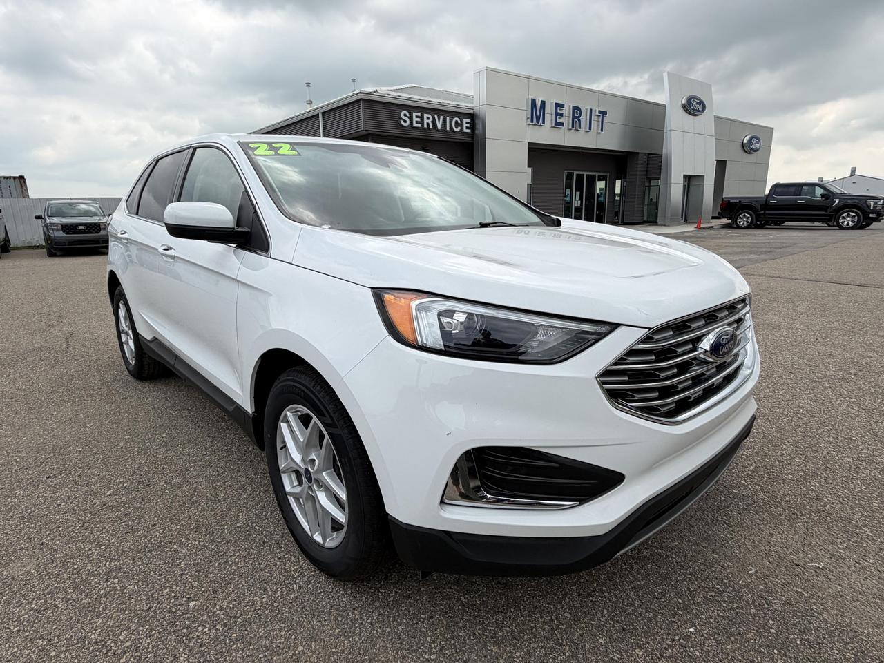 If youre looking for a capable, tech-forward SUV that works as hard as you do, this 2022 Ford Edge SEL in Oxford White deserves your attention. With under 70,000 km on the clock, AWD capability, and a long list of driver-assist and convenience features, this Edge hits a sweet spot for families and commuters who want substance over flash.

Key Highlights:
- 2.0L EcoBoost engine paired with AWD and automatic transmission  confident performance in all conditions
- Ford Co-Pilot360 suite including Blind Spot Information System (BLIS) and Cross-Traffic Alert for confident, aware driving
- Leather/metal-look steering wheel with voice activation and dual-zone automatic climate control for a refined daily experience
- Power liftgate for hands-free rear cargo access  a genuine everyday convenience
- FordPass Connect 4G Mobile Hotspot keeps passengers connected on the go
- Auto-dimming rearview mirror, auto high-beam LED headlamps, and rain-sensing wipers  thoughtful details that reduce driver fatigue
- Rear parking sensors and backup camera with washer for added confidence in tight spaces
- MyKey system with programmable safety settings  great for households with newer drivers

Merit Ford Sales is here to make the next step easy. Whether youd like to reserve this vehicle, start your purchase online, or simply book a test drive to experience it for yourself, our team is ready to help. Reach out with any questions  were happy to walk you through your options.