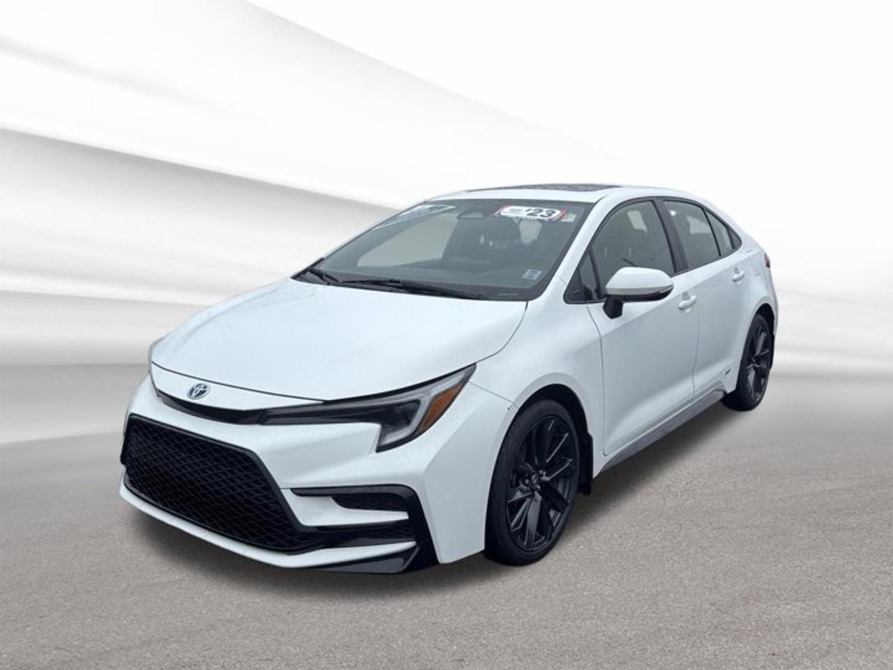 Discover efficient, confident driving in this used 2023 Toyota Corolla Hybrid Se at Steele Halifax Chrysler Dodge Jeep Ram FIAT in Halifax. Finished in White with four doors, this hybrid sedan blends everyday practicality with all-wheel drive confidence. With 67,665 km, it delivers the proven value, low fuel use, and smooth road manners many drivers want.The 2023 Toyota Corolla Hybrid Se stands out for its balanced design and smart hybrid engineering. Its 1.8-litre Gas/Electric I-4 works with a CVT for quiet, seamless performance in city traffic and on the highway. This hybrid setup helps reduce fuel stops while giving you the easy, refined drive expected from a modern compact sedan.FEATURES OF THE Corolla Hybrid SeSport-inspired hybrid sedan with all-wheel drive1.8-litre gas-electric four-cylinder powertrainSmooth continuously variable automatic transmissionFour-door practicality with efficient daily usabilityHYBRID VEHICLE FEATURESGas-electric system helps lower fuel consumptionHybrid power supports smooth urban drivingRegenerative braking helps recover driving energyEfficient design suits commuting and travelADVANCED SAFETY FEATURESToyota Safety Sense driver-assist technologies availableStability control supports secure road handlingAntilock braking system aids controlled stopsMultiple airbags help protect occupantsPERFORMANCE AND EFFICIENCY1.8-litre hybrid engine saves more fuelAll-wheel drive adds year-round confidenceCVT supports smooth and efficient accelerationHybrid sedan built for everyday economyCOMFORT AND CONVENIENCEFour-door layout improves daily passenger accessComfortable cabin designed for everyday drivingEasy controls support simple operationPractical sedan size aids city parkingTECHNOLOGY AND CONNECTIVITYDriver information display shows key dataHybrid system monitoring supports efficient drivingUser-friendly controls keep functions within reachModern cabin layout feels clear and practicalCARGO SPACETrunk area suits daily errands wellSedan design keeps cargo neatly enclosedRear seat area adds carrying flexibilityPractical storage for work or travelAWARDS & RECOGNITIONSTop Safety Pick, Insurance Institute for Highway Safety, 2023WHAT OTHER OWNERS LIKEExcellent fuel economy from hybrid systemSmooth ride quality for daily commutesEasy manoeuvring in urban environmentsConfident traction in changing weatherFor drivers who want a compact sedan with real efficiency benefits, this 2023 Toyota Corolla Hybrid Se makes a smart choice. Its hybrid powertrain helps keep operating costs low, while all-wheel drive adds welcome confidence for Canadian roads and seasons. It is practical, dependable, and easy to enjoy every day.This used hybrid sedan is a great fit for commuting, family use, and weekend travel around Halifax and beyond. If you want a well-known Toyota hybrid with strong value, useful space, and a smooth driving character, this 2023 Toyota Corolla Hybrid Se deserves a closer look at Steele Halifax Chrysler Dodge Jeep Ram FIAT.This 2023 Toyota Corolla Hybrid Ses VIN is: JTDBDMHE0P3001999 .We invite you to book a viewing and test drive at your earliest convenience