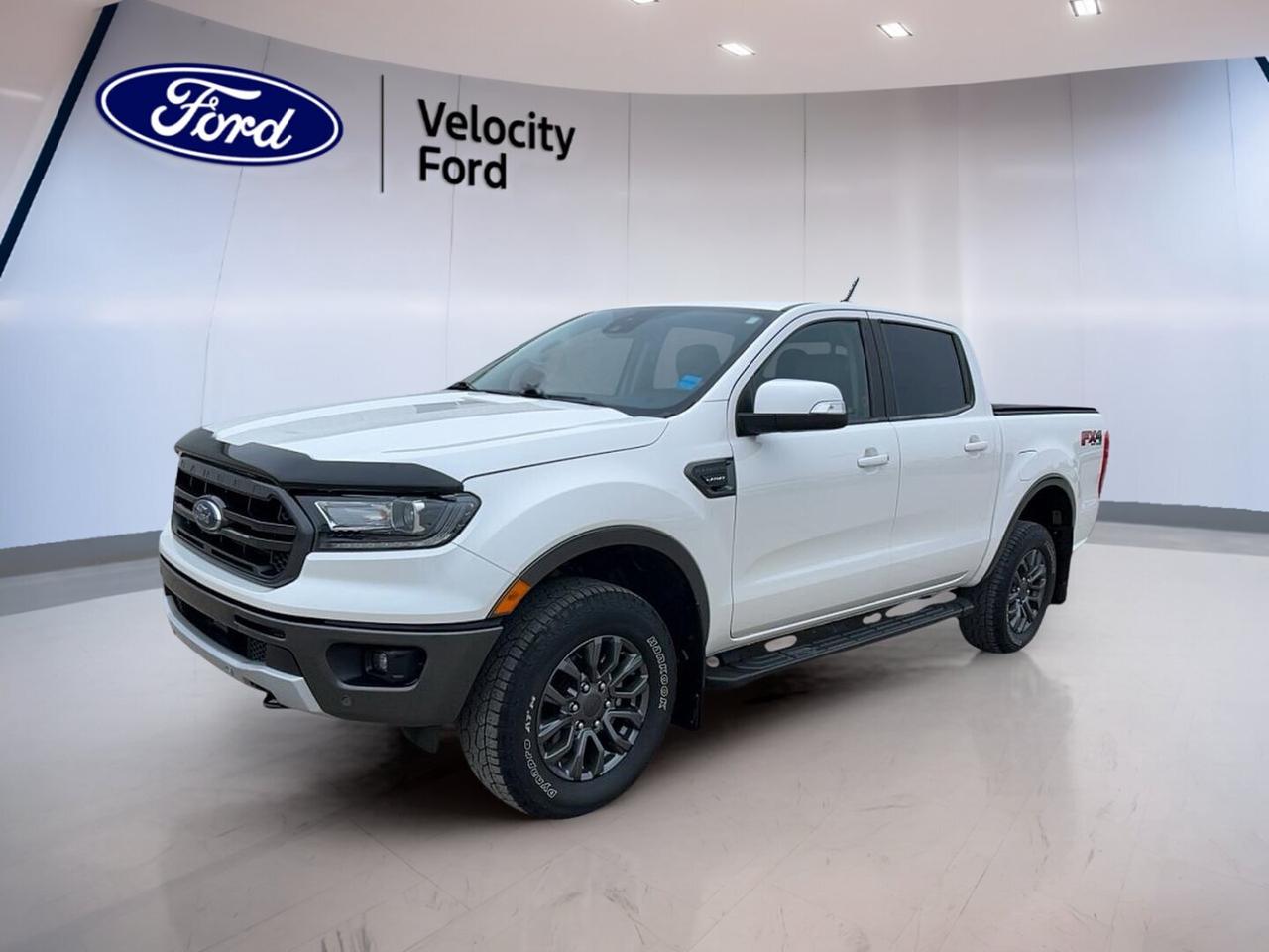 // ACCIDENT FREE!! //

Built for work, travel, and daily comfort, this 2020 Ford Ranger LARIAT 4WD SuperCrew 5 Box is a smart midsize truck for life in Moose Jaw. It comes in White with a Black interior, four doors, automatic transmission, and a 2.3-litre unleaded engine. With 78,155 km, this used Ford delivers proven capability and strong value.

The 2020 Ford Ranger LARIAT 4WD SuperCrew 5 Box gives you a refined cabin, confident four-wheel drive traction, and practical truck strength in one well-rounded package. Sold by Velocity Ford, it also offers a 1,587 kg towing capacity, making it ready for trailers, gear, and weekend projects.

FEATURES OF THE Ranger LARIAT 4WD SuperCrew 5 Box
»» LARIAT trim adds upscale comfort features
»» Four-door SuperCrew cab boosts passenger room
»» 4WD helps handle changing road conditions
»» 5-foot box supports daily hauling needs

TRUCK FEATURES
»» Tows up to 1,587 kg confidently
»» Rear tow hook adds useful recovery support
»» Off-road tires aid loose surface traction
»» SuperCrew cabin balances cargo and passengers

ADVANCED SAFETY FEATURES
»» Backup camera helps with reversing visibility
»» Blind spot monitor adds lane-change awareness
»» Lane departure warning supports safer travel
»» Side and head airbags boost protection

PERFORMANCE AND EFFICIENCY
»» 2.3-litre unleaded engine delivers solid power
»» Automatic transmission supports smooth daily driving
»» Dual shift mode adds manual control feel
»» Four-wheel drive improves traction on demand

COMFORT AND CONVENIENCE
»» Heated front seats add cold-weather comfort
»» Dual-zone climate control helps cabin comfort
»» Power front seats support easy adjustment
»» Cruise control makes highway driving easier

TECHNOLOGY AND CONNECTIVITY
»» Bluetooth integration supports hands-free calling
»» WiFi hotspot helps keep devices connected
»» Satellite radio expands entertainment choices
»» Steering wheel audio controls aid convenience

CARGO SPACE
»» 5-foot box handles everyday hauling tasks
»» Four-door cab offers flexible interior storage
»» Spare tire adds peace of mind
»» Power windows improve daily usability overall

AWARDS & RECOGNITIONS
»» Best Buy midsize pickup, The Car Guide, 2020
»» Top Safety Pick, Insurance Institute for Highway Safety, 2020

WHAT OTHER OWNERS LIKE
»» Strong turbo power for daily driving
»» Comfortable ride for a capable truck
»» User-friendly technology and simple controls
»» Useful towing strength and 4WD confidence

This 2020 Ford Ranger LARIAT 4WD SuperCrew 5 Box stands out with a premium feel and practical equipment. Highlights include heated mirrors, electric mirrors, retractable mirrors, LED headlamps, fog lights, tinted windows, push button start, automatic headlights, rear window defroster, and an auto-dimming rearview mirror.

Inside, this 2020 Ford Ranger LARIAT 4WD SuperCrew 5 Box is equipped for comfort and ease with front air conditioning, automatic climate control, adjustable steering wheel, leather steering wheel, driver lumbar support, passenger lumbar support, illuminated vanity mirrors, and automatic door locks. Safety and control are supported by ABS, stability control, tire pressure monitoring, child safety locks, and multiple airbags.

This 2020 Ford Ranger LARIAT 4WD SuperCrew 5 Boxs VIN is: 1FTER4FH2LLA46495.