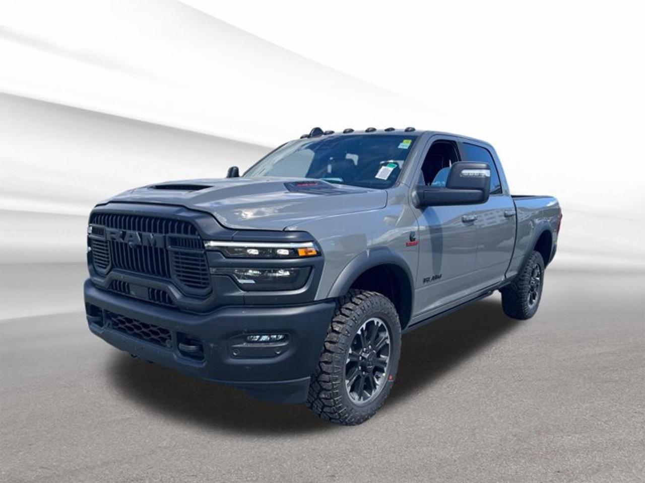 Built for hard work and ready for Halifax roads, the brand new 2026 RAM 2500 Rebel brings heavy-duty diesel strength, bold style, and real capability to every job. Finished in Grey with a Black interior, this four-door truck pairs a confident look with 4-wheel drive and the proven pull of a 6.7-litre intercooled turbo diesel I-6.At Steele Halifax Chrysler Dodge Jeep Ram FIAT, this 2026 RAM 2500 Rebel stands out for drivers who want serious truck performance with useful comfort. Its automatic transmission helps deliver smooth power, while selected features like the Power Sunroof, Brush Guard, Rain-Sensing Windshield Wipers, and Heated Steering Wheel add value where it counts most.FEATURES OF THE 2500 RebelHeavy-duty Rebel trim with bold stanceGrey exterior with Black interiorFour-door cabin for easy accessPower Sunroof adds open-air feelTRUCK FEATURESTurbo diesel power for demanding workFour-wheel drive for added tractionStrong chassis supports heavy-duty capabilityBrush Guard adds front-end protectionADVANCED SAFETY FEATURESRain-sensing wipers help in poor weatherFour-wheel drive aids slippery road controlBrush Guard adds extra front protectionStrong truck build inspires daily confidencePERFORMANCE AND EFFICIENCY6.7-litre turbo diesel I-6 powerAutomatic transmission supports smooth shiftingDiesel torque suits towing and haulingHeavy-duty design built for tough tasksCOMFORT AND CONVENIENCEHeated Steering Wheel for cold morningsFour doors improve passenger accessPower Sunroof brightens the cabinSpacious layout supports daily usabilityTECHNOLOGY AND CONNECTIVITYAutomatic transmission simplifies daily drivingRain-sensing wipers reduce driver distractionClear truck-focused layout aids operationModern controls support easy useCARGO SPACEPickup bed supports gear and toolsCabin offers room for passengersFour-door design improves loading flexibilityHeavy-duty format suits work equipmentWHAT OTHER OWNERS LIKEStrong diesel torque for big jobsConfident four-wheel drive capabilityComfortable ride for a heavy-duty truckBold Rebel style with useful featuresThis 2026 RAM 2500 Rebel is a smart choice for drivers who need real truck strength without giving up everyday comfort. The diesel engine is well known for strong low-end pulling power, which helps when towing, hauling, or moving through rough conditions. In Halifax, that kind of capability can make a real difference through changing seasons.The Grey exterior gives this truck a clean and modern look, while the Black interior keeps the cabin practical and easy to live with. The Brush Guard adds a rugged touch up front, and the Power Sunroof brings more light and fresh air into the cabin. Rain-Sensing Windshield Wipers help when weather shifts fast, and the Heated Steering Wheel adds welcome comfort on cold Atlantic mornings.For drivers shopping at Steele Halifax Chrysler Dodge Jeep Ram FIAT, this brand new 2026 RAM 2500 Rebel offers a strong mix of durability, presence, and everyday usefulness. It is built for work, ready for adventure, and equipped with the features you asked for, all in one capable heavy-duty pickup.This 2026 RAM 2500 Rebels VIN is: 3C6UR5EL3TG313784.We invite you to book a viewing and test drive at your earliest convenience