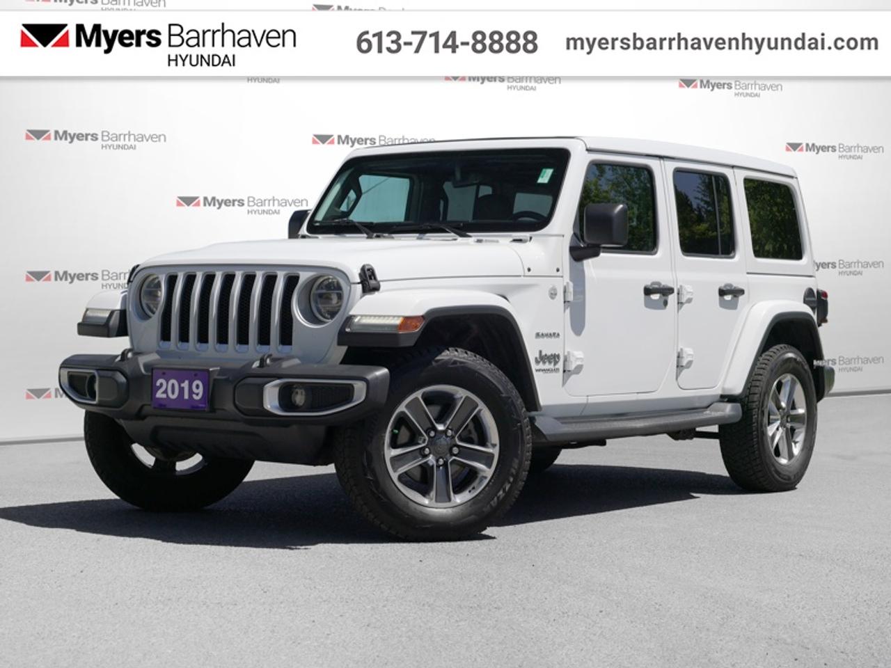 <b>Uconnect, Aluminum Wheels, Android Auto, Apple CarPlay, Dana Axles, Steering Wheel Audio Control, Fog Lamps, Bluetooth, Remote Keyless Entry, Trail Rated, 4x4</b><br> <br>  Compare at $29855 - Our Price is just $28985! <br> <br>With the iconic Wrangler name, 60 years of off roading heritage, and 4 doors to fit the whole crew, this Wrangler Unlimited is all your family needs. This 2019 Jeep Wrangler Unlimited is for sale today.<br> <br>This Wrangler Unlimited is by no means less capable for having 4 doors. Its just able to carry more people and gear. Whether your familys next adventure is across a mountain pass, through a muddy trail, or just down the highway to Grandmas, this Wrangler Unlimited has you covered.<br> <br>This SUV has 95,989 km. Its White in colour and is completely accident free based on the <a href=https://vhr.carfax.ca/?id=8rJE2TJSWLUvYmED81/a9n+OtbhKJb2L target=_blank>CARFAX Report</a>. It has a Manual transmission and is powered by a 285HP 3.6L V6 Cylinder Engine. It may have some remaining factory warranty, please check with dealer for details. <br> <br> Our Wrangler Unlimiteds trim level is Sahara. This Unlimited Sahara Wrangler has a lot more goodies over the base Sport model. To make sure you and your passengers stay connected and entertained, you will get the Uconnect 4 with 7 inch touchscreen, Apple CarPlay, Android Auto, SiriusXM, Bluetooth, 4 USBs and and aux jack, 8 speakers, and ambient interior LED lighting. Skid plates, a tool kit, two front tow hooks and one rear, Dana axles, shift on the fly 4x4 system, heavy duty suspension, fog lights, automatic headlamps, aluminum wheels, and tubular side steps help you rule the trail, while a rear view camera, illuminated cup holders, leather steering wheel with audio and cruise control, remote keyless entry, power windows, 115 volt power outlet, automatic climate control, and heated power side mirrors help you stay comfortable on the road.<br> To view the original window sticker for this vehicle view this <a href=http://www.chrysler.com/hostd/windowsticker/getWindowStickerPdf.do?vin=1C4HJXEG4KW560974 target=_blank>http://www.chrysler.com/hostd/windowsticker/getWindowStickerPdf.do?vin=1C4HJXEG4KW560974</a>. <br/><br> <br/>Buy this vehicle now for the lowest bi-weekly payment of <b>$248.71</b> with $2899 down for 60 months @ 7.99% APR O.A.C. ( Plus applicable taxes - & fees ). See dealer for details. <br><br>*LIFETIME ENGINE TRANSMISSION WARRANTY NOT AVAILABLE ON VEHICLES WITH KMS EXCEEDING 140,000KM, VEHICLES 8 YEARS & OLDER, OR HIGHLINE BRAND VEHICLE(eg. BMW, INFINITI. CADILLAC, LEXUS...) o~o