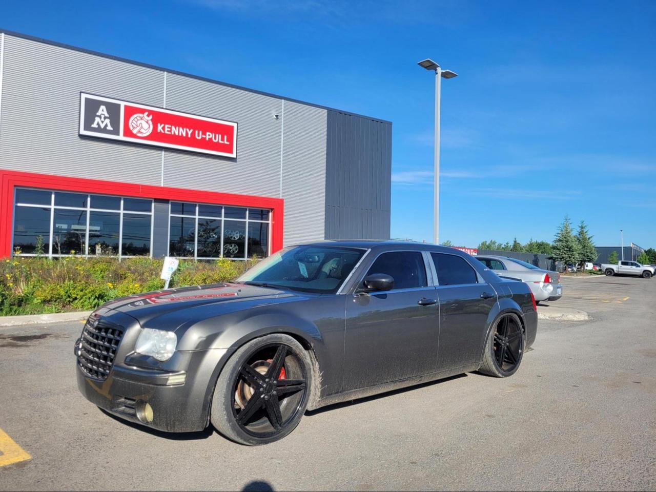 2008 Chrysler 300C in Dark Titanium Metallic. The vehicle has 187,697km. The vehicle runs and drives. No Check engine light. Vehicle is lowered. Aftermarket rims. Some imperfections/rust around the body. We dont perform any mechanical/safety inspections. The vehicle is sold as is and might need some work.