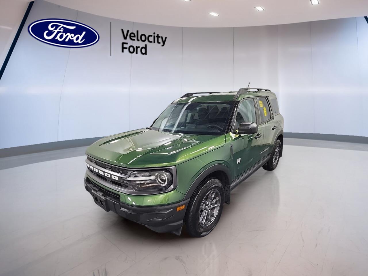 Meet the 2024 Ford Bronco Sport Big Bend 4x4, now available used at Velocity Ford in Moose Jaw. Finished in Green with a Black interior, this four-door SUV blends everyday comfort with true utility. Its 1.5-litre unleaded engine and 8-speed automatic transmission deliver smooth power, while 28,780 km shows this Bronco Sport Big Bend 4x4 is ready for many more adventures.

Built for Canadian roads and changing weather, the 2024 Ford Bronco Sport Big Bend 4x4 gives you confident four-wheel drive traction, practical cargo access, and a smart mix of comfort and safety. From city errands to weekend escapes, this SUV offers the versatility drivers want in a compact utility vehicle.

FEATURES OF THE Bronco Sport Big Bend 4x4
»» Four-wheel drive for added road confidence
»» 1.5-litre engine with automatic transmission
»» Green exterior with black interior finish
»» Four-door design with versatile utility

ADVANCED SAFETY FEATURES
»» Backup camera helps with reversing visibility
»» Blind spot monitor supports safer lane changes
»» Lane departure warning adds driving confidence
»» Multiple airbags enhance occupant protection

PERFORMANCE AND EFFICIENCY
»» 1.5-litre unleaded engine balances daily efficiency
»» Eight-speed automatic supports smooth shifting
»» Four-wheel drive improves traction on roads
»» Stability control helps maintain composed handling

COMFORT AND CONVENIENCE
»» Heated front seats add winter comfort
»» Automatic climate control keeps cabin pleasant
»» Drivers power seat supports easy adjustment
»» Cruise control helps on longer drives

TECHNOLOGY AND CONNECTIVITY
»» Bluetooth integration supports hands-free communication
»» Steering wheel audio controls add convenience
»» Satellite radio expands listening choices
»» Push button start simplifies daily use

CARGO SPACE
»» Rear trunk access improves loading convenience
»» Four-door layout helps passenger entry
»» Spare tire adds practical peace of mind
»» Flexible interior suits daily cargo needs

AWARDS & RECOGNITIONS
»» Top Safety Pick, Insurance Institute for Highway Safety, 2024

WHAT OTHER OWNERS LIKE
»» Easy-to-drive size for daily travel
»» Useful cargo room for active lifestyles
»» Confident all-weather four-wheel drive capability
»» Comfortable ride with practical technology

This used 2024 Ford Bronco Sport Big Bend 4x4 also includes helpful everyday features that make each drive easier. You get power steering, anti-lock braking system, power windows, heated and electric mirrors, tinted windows, automatic headlights, rear window defroster, tire pressure monitoring, child safety locks, and automatic door locks. Details like the auto-dimming rearview mirror, illuminated vanity mirrors, ambient lighting package, and driver lumbar support add a thoughtful touch.

The Green exterior gives this 2024 Ford Bronco Sport Big Bend 4x4 a fresh and outdoors-ready look, while LED headlamps help improve visibility in low-light conditions. Inside, the cabin is designed to be practical and comfortable, with clear controls and useful features placed where you need them most.

If you want a compact SUV with four-wheel drive confidence, modern safety, and everyday comfort, this 2024 Ford Bronco Sport Big Bend 4x4 at Velocity Ford in Moose Jaw is a smart choice. It offers the right mix of efficiency, versatility, and value for drivers who need one vehicle that can do more.

This 2024 Ford Bronco Sport Big Bend 4x4s VIN is: 3FMCR9B60RRF14528.