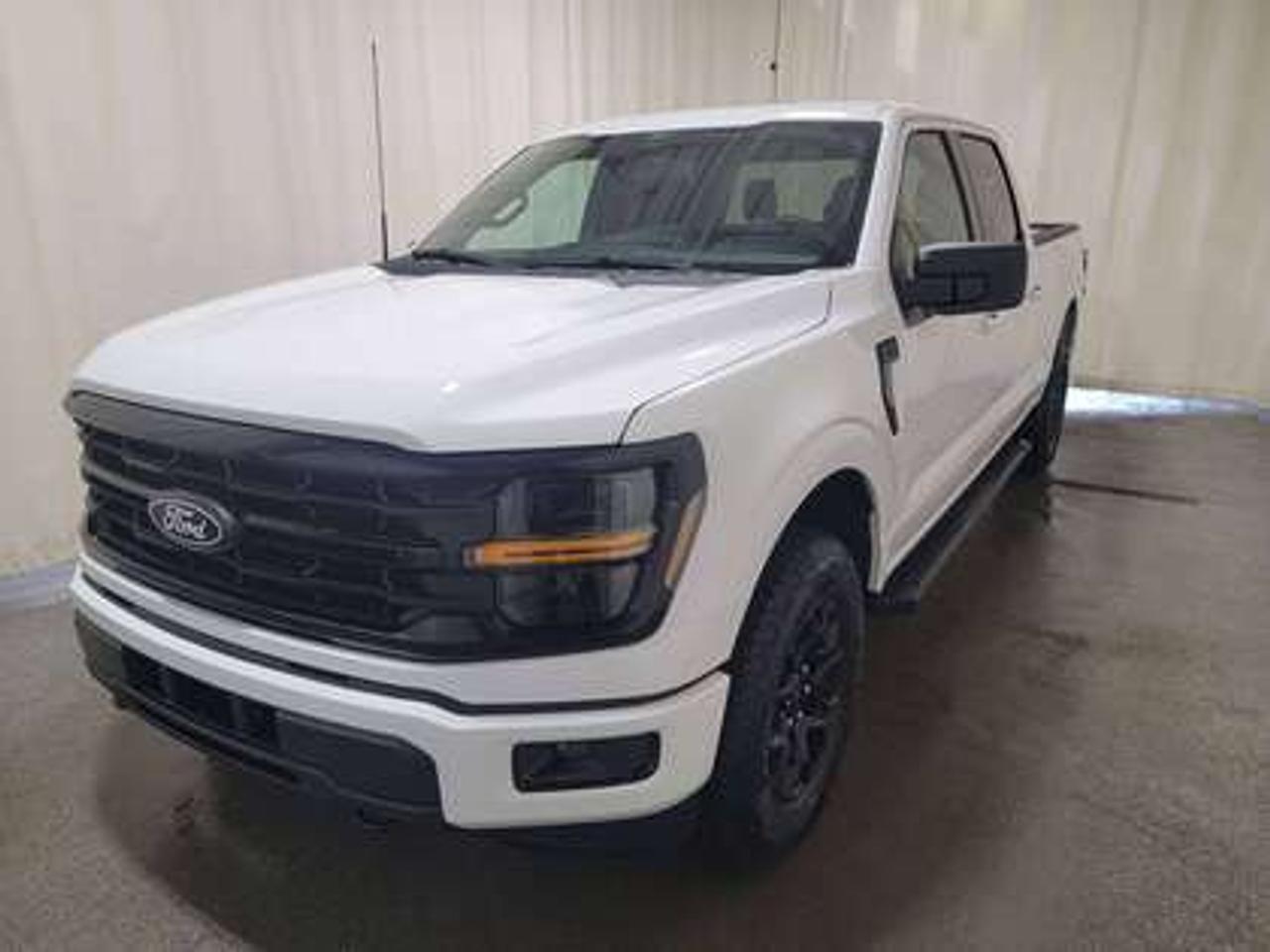 This all-new, full-sized 2026 Ford F-150 XLT  301A is a showstopper in Oxford White. This pickup is equipped with the 3.5L EcoBoost engine, producing 400 horsepower and 500 lb-ft of torque. Paired with a 10-speed automatic transmission, this truck achieves a combined fuel economy of 12.3L/100km (23 miles per gallon), making it both powerful and efficient. 

Key Features:
12 LCD Captivity Touchscreen
Electronic Power-Assist Steering
Dual-Zone Electronic Auto Temp Control
Cruise Control
Power Windows
AdvanceTrac® With Roll Stability Control
Perimeter Alarm
Ford Co-Pilot360
Lane Keeping System
Rear View Camera
Rear Parking Sensors
Reverse Park Assist
Class IV Trailer Hitch
Power Drivers Seat
Remote Start
SYNC®4
Apple Car Play
18 All Terrain Tires
Bluetooth Connectivity
XLT Black Appearance Package
Engine Block Heater
Tow/Haul Package

This vehicle comes with the All-Weather Packageready to take on any season!
Snow, rain, mud, or sunshinethis vehicle is built for it all! The All-Weather Package adds extra protection where it matters most, with premium mud flaps to shield your paint from road debris, all-weather floor mats to protect your interior from lifes messes, and Xpel paint protection to help guard against those infuriating rock chips. Drive with confidence, knowing your investment is protected from Regina's elements.
 
Bennett Dunlop Ford, proudly serving Regina for over 40 years, is conveniently located at 770 Broad Street. With over 3,500 Google reviews, our reputation reflects our commitment to providing a fast, easy, and enjoyable vehicle-buying experience. We eliminate the hassle with no admin or documentation fees, transparent upfront pricing that lets you shop with total confidence. But were more than just a dealershipwere driven to make a difference by supporting local community initiatives and events that matter to you. Visit Bennett Dunlop Ford today and experience why were Reginas trusted choice for quality vehicles, exceptional service, and a genuine commitment to driving change in our community!