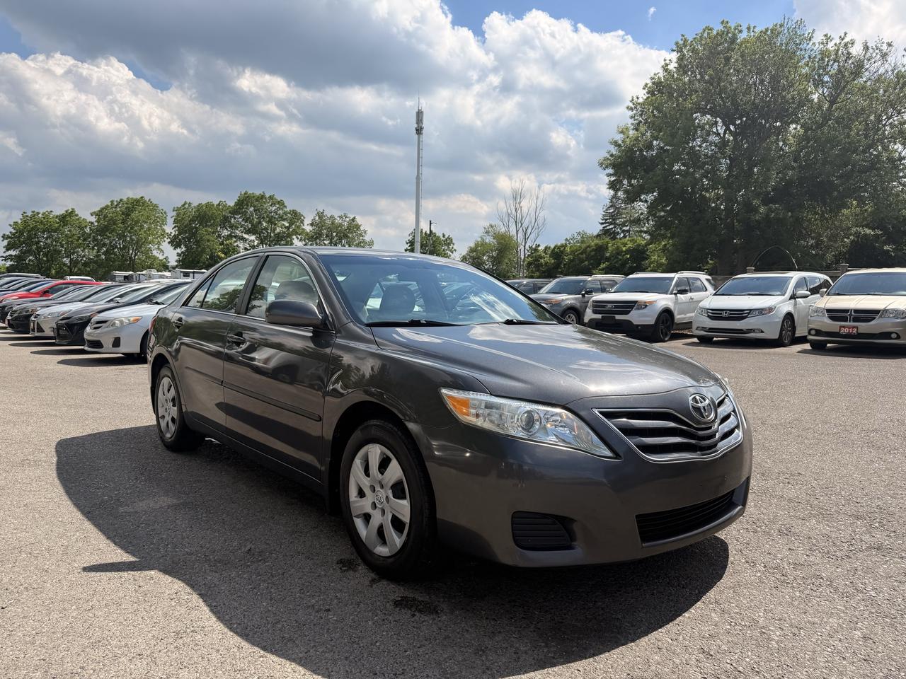 <p>Looking for a reliable and comfortable sedan thats perfect for your daily commute and weekend adventures? Target Auto Centre is excited to present this 2011 Toyota Camry LE, a timeless choice renowned for its dependability and smooth ride. Finished in a sophisticated grey exterior with a matching grey interior, this Camry exudes a classic appeal that stands the test of time. Beneath the hood lies a fuel-efficient 2.5L I4 engine paired with a seamless automatic transmission, offering a responsive and enjoyable driving experience. With 199,495 kilometers on the odometer, this well-maintained Camry has plenty of life left to offer its next owner.&nbsp;This 2011 Toyota Camry LE is more than just a car; its a smart investment in dependable transportation. Its reputation for longevity and low maintenance costs makes it a standout option for anyone seeking peace of mind on the road. The spacious interior provides ample room for passengers and cargo, making it ideal for families, commuters, and anyone who values comfort and practicality. At Target Auto Centre, we understand the importance of a vehicle you can trust, and this Camry LE certainly fits the bill.</p><p>&nbsp;</p><hr><p>&nbsp;</p><p dir=ltr><strong>CERTIFIED PRE-OWNED VEHICLE | BUY WITH CONFIDENCE</strong></p><p dir=ltr>&nbsp;- Ontario Safety Standards Certificate Included<br>- 30 Day / 1,000 KM Safety Warranty Included<br>- Fully Detailed Prior to Delivery<br>- CARFAX Vehicle History Report Available</p><p>&nbsp;</p><hr><p>&nbsp;</p><p dir=ltr><strong>VALUE AND TRANSPARENCY | WHY CHOOSE US</strong></p><p dir=ltr>- Price Plus HST & Licensing Only<br>- No Additional Fees | All-In Pricing<br>- Same Price Cash or Finance<br>- Extended Warranty Protection Plans Available<br>- Autotrader Best Priced Dealer Award (2024)<br>- Competitive Market Value on Trade-ins<br>- We&rsquo;ll Buy Your Car &mdash; No Purchase Required<br>- Know Someone Looking For a Vehicle? Get a Referral Award<br>- Open 7 Days a Week</p><p>&nbsp;</p><hr><p>&nbsp;</p><p dir=ltr><strong>ABOUT TARGET AUTO CENTRE</strong></p><p dir=ltr>Target Auto Centre has been proudly serving London, Ontario and surrounding areas for over 20 years, offering over 150 quality pre-owned vehicles and a constantly updated selection to choose from. We focus on providing competitive pricing, clear information, and a straightforward buying process so you know exactly what to expect from start to finish.</p><p dir=ltr>Cars For Everyone! We offer a wide selection of vehicles to fit every lifestyle, need, and budget. Our inventory includes cars, trucks, SUVs, and vans from trusted brands such as Ford, Chevrolet, Toyota, Honda, Nissan, BMW, Mercedes-Benz, Audi, Lexus, Acura, Hyundai, Kia, Mazda, Volkswagen, Jeep, RAM, GMC, Subaru, and more. With new arrivals regularly, there&rsquo;s always something for everyone.</p><p dir=ltr>As a proud member of the Used Car Dealers Association of Ontario (UCDA), we are committed to operating with honesty, transparency, and professionalism in every transaction. Our goal is to make your vehicle purchase as simple and stress-free as possible, while delivering the level of service our customers continue to trust. Come visit us today and see why were the preferred choice for pre-owned vehicles in London and the surrounding areas. We look forward to earning your business!</p><p>&nbsp;</p>