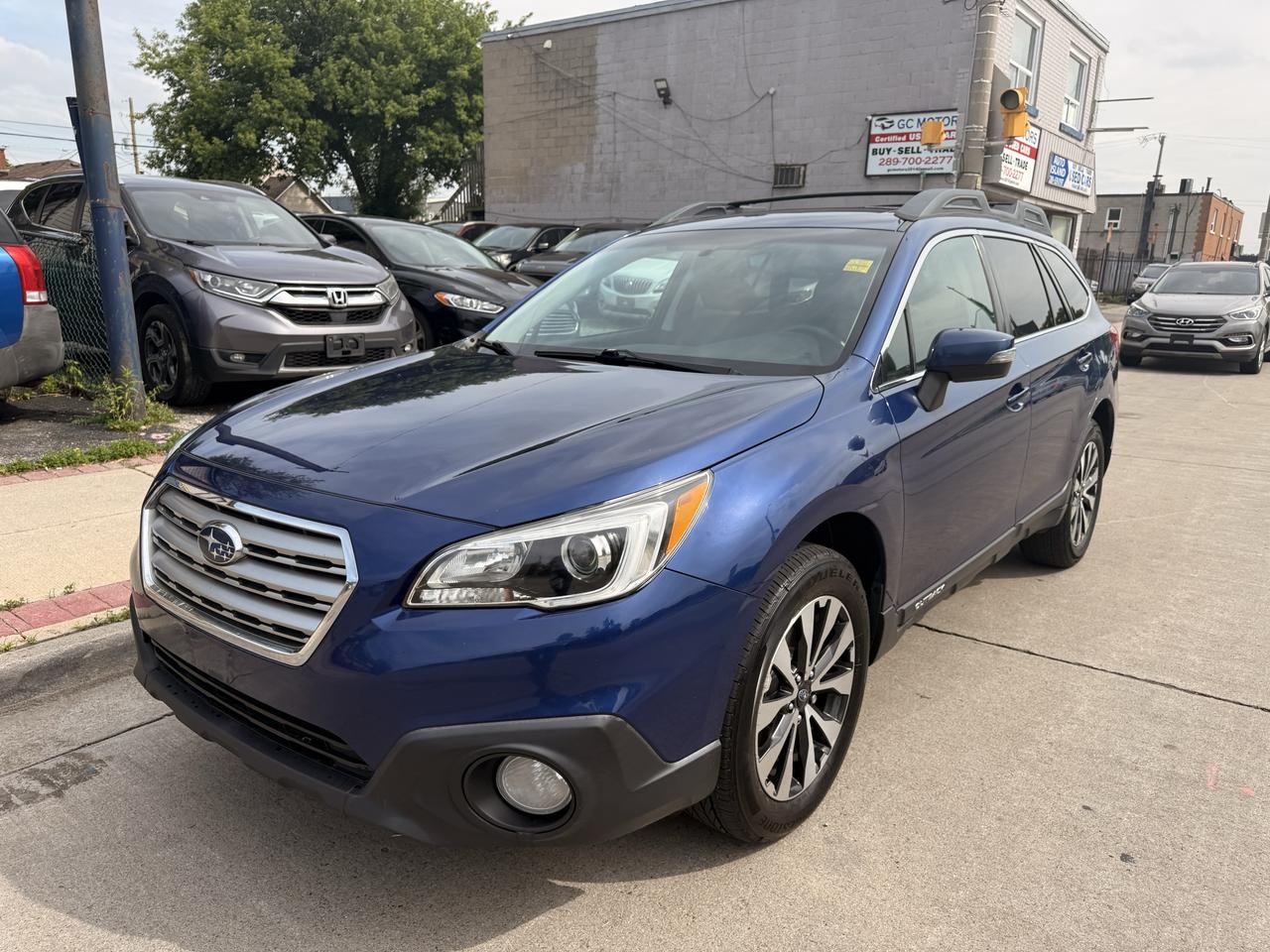 2015 Subaru Outback 5dr Wgn CVT 2.5i w/Limited & Tech Pkg Photo
