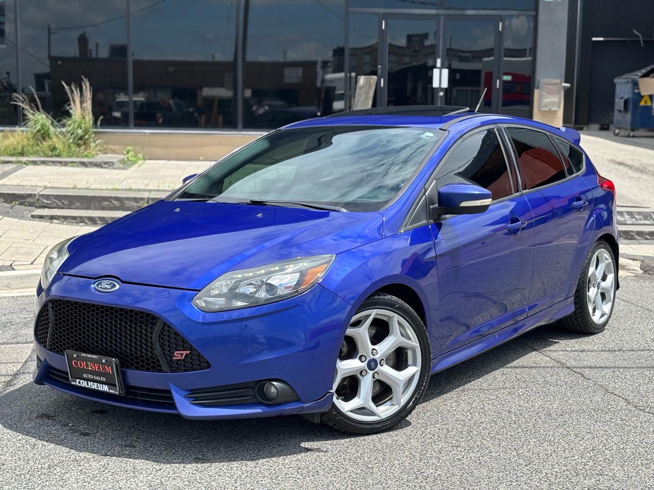 <p><p><span>**THIS VEHICLE COMES FULLY CERTIFIED WITH A SAFETY CERTIFICATE & SERVICED AT NO EXTRA COST**&nbsp; &nbsp;</span></p><p><span>NO ACCIDENTS!! NO MODIFICATIONS!! CARFAX VERIFIED!! WELL MAINTAINED!!&nbsp;<span id=jodit-selection_marker_1781112636580_9044416416070487 style=line-height: 0; display: none; data-jodit-selection_marker=start></span> &nbsp;</span><br></p><p><span>2014 Ford Focus ST  Performance Blue  6 Speed Manual</span></p><p><span>If youre looking for one of the most fun hot hatches ever built, this 2014 Ford Focus ST delivers. Finished in the iconic Performance Blue and paired with the sought-after 6-speed manual transmission, this turbocharged hatchback offers the perfect balance of practicality and performance.</span></p><p><span>Powered by a 2.0L EcoBoost turbocharged engine producing 252 horsepower and 270 lb-ft of torque, the Focus ST delivers exhilarating acceleration, razor-sharp handling, and an engaging driving experience every time you get behind the wheel.</span></p><p><span>The aggressive ST styling, sport-tuned suspension, and driver-focused cockpit make this a true enthusiasts car while still offering the versatility of a hatchback.</span></p><p><span>Features include:</span><br><span> 6-Speed Manual Transmission</span><br><span> 2.0L Turbocharged EcoBoost Engine</span><br><span> Performance Blue Exterior</span><br><span> Sport Seats</span><br><span> Alloy Wheels</span><br><span> Dual-Zone Climate Control</span><br><span> Bluetooth Connectivity</span><br><span> Cruise Control</span><br><span> Power Windows & Locks</span><br><span> Keyless Entry</span></p><p><span>The Focus ST has earned its reputation as one of the best drivers cars in its class, combining turbocharged performance with everyday usability.</span></p><p><span>Built to thrill. Practical enough for daily life. Fast enough to put a smile on your face.</span></p><p><span>A true modern hot hatch thats becoming harder to find in clean condition. Dont miss your chance to own this Performance Blue ST.</span></p><p><span>Contact for more details or to arrange a viewing.</span></p><p>COLISEUM AUTO SALES ON WESTON </p><p>301 WESTON ROAD </p><p>TORONTO, ON M6N 3P1 </p><br><p>4 1 6 - 7 6 6 - 2 2 7 7</p><br></p>