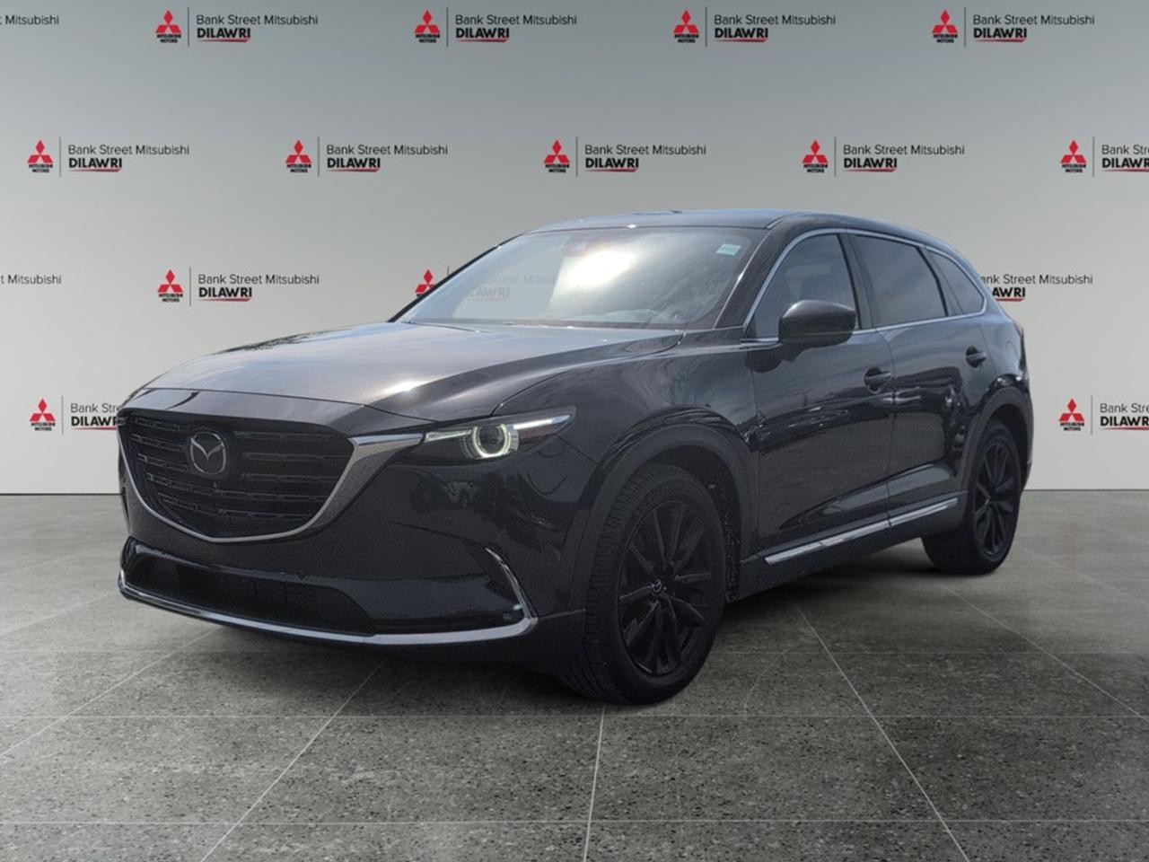 Balance of 5 year/100,000kms BASIC warranty and 10 year/160,000kms Factory Powertrain Warranty on ALL MITSUBISHI products! Best in the industry!!!! The 2022 Mazda CX-9 GT AWD in striking black is the perfect blend of sophistication and capability. This all-wheel-drive SUV, paired with an automatic transmission, offers exceptional handling in various driving conditions. The bold exterior is complemented by shiny alloy wheels, while the elegant interior features luxurious leather seats, offering both heated and cooled options for your comfort, regardless of the season. The third row provides ample space for your passengers, making every journey a comfortable one. Stay connected and in control with smart device integration, Bluetooth connectivity, and a cutting-edge navigation system displayed through a vivid screen. Safety features include a backup camera, lane assist, parking sensors, and a comprehensive heads-up display to keep your eyes on the road. The added convenience of a keyless entry, power seats, and power windows enhances your driving experience. The 2022 Mazda CX-9 GT AWD is perfect for families or individuals who prioritize comfort, technology, and safety. Reach out to Bank Street Mitsubishi to learn more about this exceptional vehicle and schedule a test drive today!