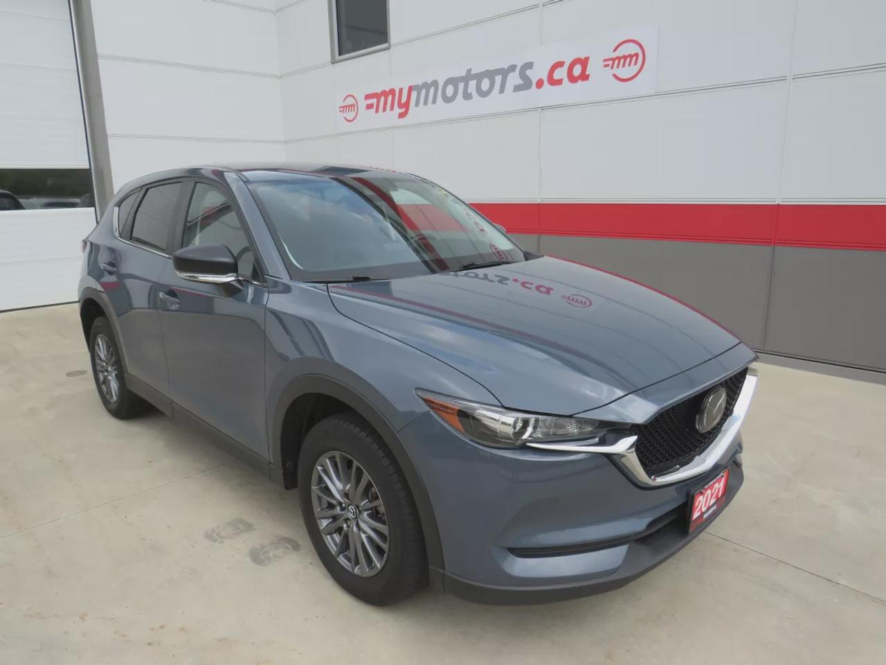 2021 Mazda CX-5 GS    | AWD | Alloy Wheels | Heated Front Seats | Heated Steering Wheel | Blind Spot Monitoring | Lane Departure Warning | Lane Keep Assist | Forward Collision Warning | Adaptive Cruise Control | Backup Camera | Apple CarPlay & Android Auto | Bluetooth | Push Button Start | Keyless Entry | Dual Zone Climate Control | Power Driver Seat | Rain Sensing Wipers | Auto Headlights | Cruise Control | USB Inputs |    | Safety Certified | Detailed | No Hidden Fees | Financing Options Available - We Deal With All Major Banks Just Like Big Brand Dealers    Hours:  Monday - Wednesday & Friday 8:00am-5:00pm - Thursday 8:00am-7:00pm  Saturday 8:00am-1:00pm    Address:  7 Rouse Street W, Tillsonburg, N4G 5T5