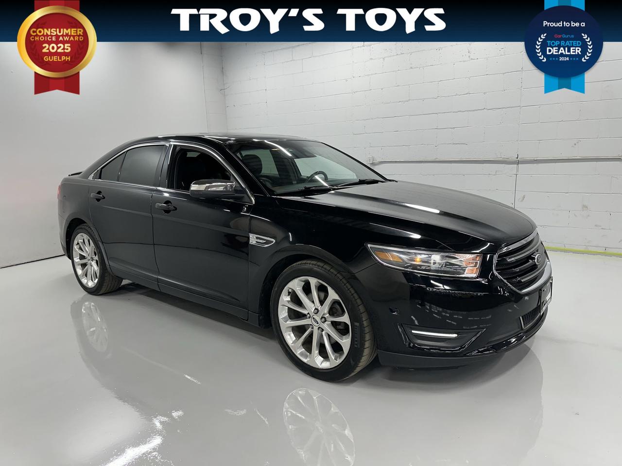 <p>Prepare to command the road in this sleek, pre-owned 2016 Ford Taurus 4DR SDN LIMITED AWD, a sophisticated sedan ready for your next adventure. Dressed in a timeless black exterior and complemented by a refined black interior, this Taurus exudes an air of quiet confidence. Under the hood, the robust 3.5L V6 engine provides ample power for both city commutes and highway cruising, while the Flex Fuel capability offers you flexibility at the pump. Whether youre navigating slick Canadian winter roads or enjoying a sunny summer drive, the All-Wheel Drive system ensures confident handling and stability in all conditions.</p><p>This 2016 Ford Taurus, with just 148,851 kilometers on the odometer, is a testament to its enduring quality and thoughtful design. The spacious four-door sedan body style offers comfortable seating for you and your passengers, making it an ideal choice for families or anyone who values a smooth and composed ride. Troys Toys is proud to offer this exceptional vehicle, a blend of performance, comfort, and dependable Ford engineering.</p><p>Here are five features of this 2016 Ford Taurus that truly shine:</p><ul><li><strong>All-Wheel Drive (AWD):</strong> Conquer any Canadian weather with unwavering confidence, from snowy backroads to rain-slicked highways, this AWD system provides superior traction and control.</li><li><strong>Powerful 3.5L V6 Engine:</strong> Experience exhilarating acceleration and smooth, responsive power that makes every drive a pleasure, whether youre merging onto the highway or tackling a mountain pass.</li><li><strong>LIMITED Trim:</strong> Indulge in an elevated driving experience with the premium features and refined appointments that come standard with the LIMITED trim level.</li><li><strong>Flex Fuel Capability:</strong> Enjoy the freedom to choose your fuel, offering you flexibility and potential cost savings at the pump.</li><li><strong>Sleek Black Exterior & Interior:</strong> Make a statement with this classic and sophisticated colour combination that exudes timeless style and luxury, turning heads wherever you go.</li></ul><p><strong><em>Powered by AutoIntelligence&trade;</em></strong></p><p>Vehicle information has been generated using artificial intelligence and is provided for informational purposes only. While efforts are made to ensure accuracy, please confirm all details directly with the dealer.</p>