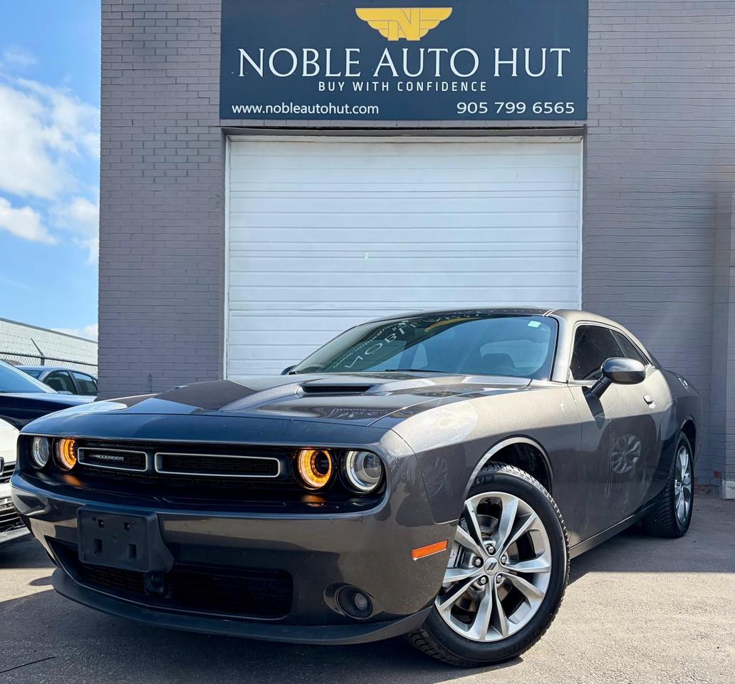 <p><strong>2020 DODGE CHALLENGER SXT PLUS AWD</strong>, KEYLESS ENTRY, REMOTE START, SUNROOF, BACKUP CAMERA, LEATHER SEATS, PARK SENSOR, ALLOY WHEELS, HEATED SEATS, PUSH BUTTON START, ANDROID/ APPLE CARPLAY,6-CYCLINDER 3.6L, CLEAN CARFAX AND MUCH MORE</p><p><strong>HST and Licensing will be extra**</strong></p><p><strong>&bull; On Financed Deals:&nbsp;</strong>We must call this a &ldquo;Finance Fee&rdquo;. It will be a separate line item on the documentation. This fee has already been included in any payment quote advertised by Noble Auto Hut. Our&nbsp;<strong><em>Finance Fee</em></strong>&nbsp;is&nbsp;<strong><em>$999.</em></strong></p><p>&bull; Vehicles sold at Noble Auto Hut are&nbsp;<strong>sold &ldquo;As-Is&rdquo;&nbsp;</strong>and are subject to an optional&nbsp;<strong>Safety Inspection Fee of $799.&nbsp;<em>This vehicle is being sold &ldquo;as-is&rdquo;, unfit, not e-tested and is not represented as being in a road worthy condition, mechanically sound or maintained at any guaranteed level of quality. The vehicle may not be fit for use as a means of transportation and may require substantial repairs at the purchaser&rsquo;s expense. It may not be possible to register the vehicle to be driven in its current condition.</em></strong></p><p><strong>OMVIC FEE&nbsp;</strong></p><p>Ontario Motor Vehicle Industry Council&nbsp;<strong>charges each person in Ontario $22 when they make a vehicle purchase.</strong>&nbsp;</p><p><strong>Licensing Fee&nbsp;</strong></p><p>Noble Auto Hut will facilitate the registration of your new vehicle with Service Ontario. We simply ask to be reimbursed for the cost of registration. This is a common practice when purchasing a vehicle.&nbsp;<strong>$32&nbsp;</strong>to attach your existing license plates to your new vehicle.&nbsp;<strong>$59&nbsp;</strong>to purchase and register new license plates to your new vehicle. Heavy-duty and Commercial Vehicles have varying costs of registration depending on weight and usage.</p><p><strong>Noble Auto Hut Inclusions Explained</strong></p><p><strong>Safety Inspection&nbsp;</strong>Noble Auto Hut will perform an Ontario Safety Standards Inspection on each vehicle at time of sale. Any repairs required to meet Ontario Safety Standards will be done. Noble Auto Hut will provide this service for an&nbsp;<strong><u>optional</u>&nbsp;fee of $799</strong>.&nbsp;</p><p><strong>On Cash Deals:&nbsp;</strong>We must call this a &ldquo;Cash Purchase Surcharge&rdquo;. It will be added to the selling price of the vehicle on the documentation.&nbsp;Our&nbsp;<strong><em>Cash Purchase Surcharge</em></strong>&nbsp;is&nbsp;<strong><em>$999.</em></strong></p><p><strong>Keys:&nbsp;</strong>Noble Auto Hut guarantees at least 1 operational key with each vehicle. In the case that a client would like additional keys, they will be made available at our industry wholesale pricing.</p><p><strong>Vehicle History:</strong>&nbsp;CarFax Vehicle History Reports are readily available when requested. We are happy to provide clients with everything required for them to make an informed decision.</p><p><strong>Fuel & Detail:&nbsp;</strong>Each vehicle will be delivered to its new owner with at least half a tank of fuel and will be fully detailed prior to the client taking delivery.</p><p><strong>15 Hale Rd&nbsp;</strong><strong>Brampton&nbsp;</strong>Come in for a test drive and speak to our sales staff, who will look after all your automotive needs with a friendly, low-pressure approach. Get approved and drive away in your new ride today!</p><p>FINANCING AVAILABLE AT AS LOW AS 6.99% O.A.C</p><p>WE WELCOME EVERYONE-GOOD/BAD CREDIT, NEWCOMERS, STUDENTS. EVERYONE IS APPROVED.</p><p>PREVIOUSLY DECLINED BY BANK ? NO PROBLEM&nbsp;</p><p>LET THE EXPERIENCED PROFESSIONALS HANDLE YOUR CREDIT APPLICATION.&nbsp;</p><p>APPLY FOR PRE-APPROVAL TODAY!!</p><h4>Warranty</h4><p>36 DAY/1000 KMS WARRANTY ON SAFETY ITEMS.</p><p>EXTENDED WARRANTY AND GAP INSURANCES ARE AVAILABLE ON REQUEST</p>