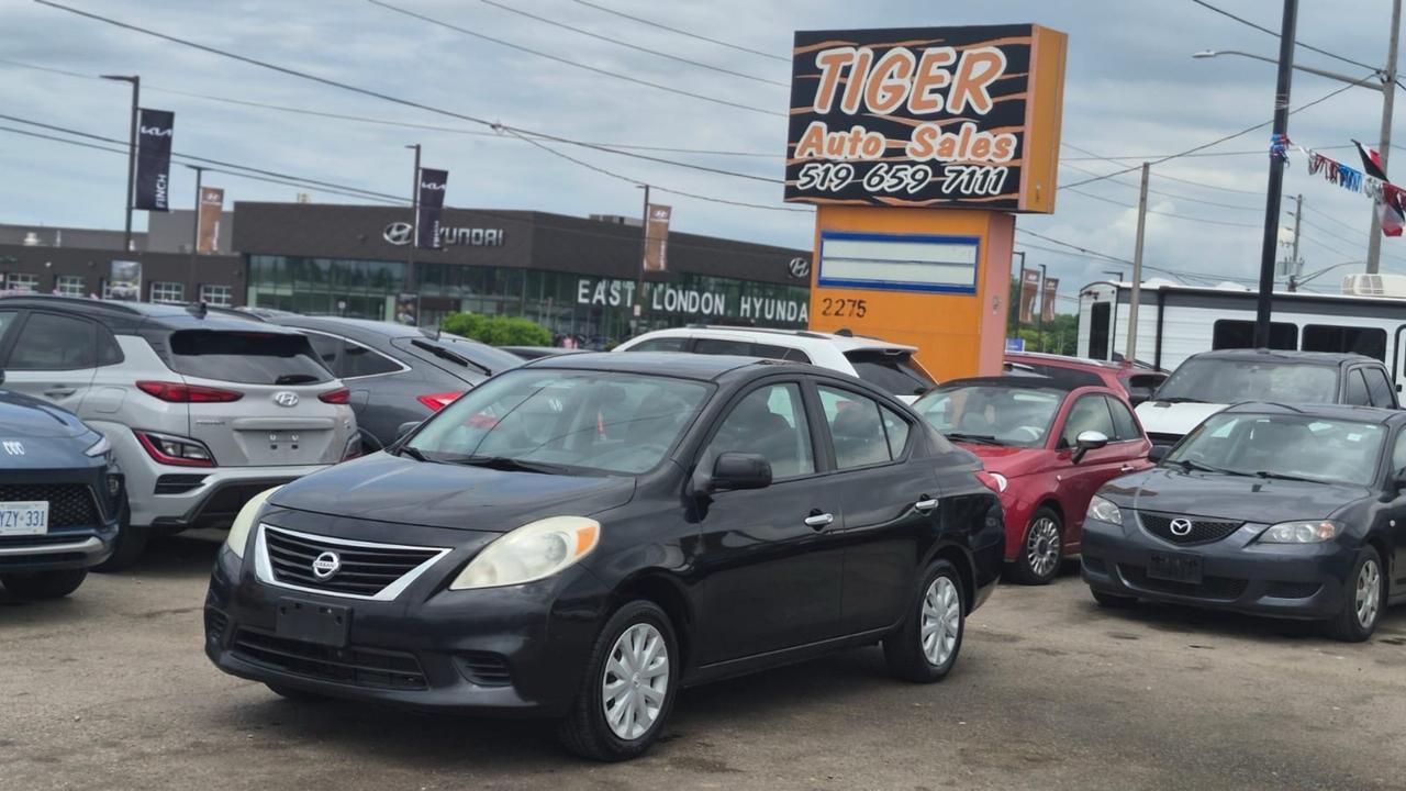 2012 Nissan Versa SV, MANUAL, SEDAN, GREAT ON FUEL, CERTIFIED Photo