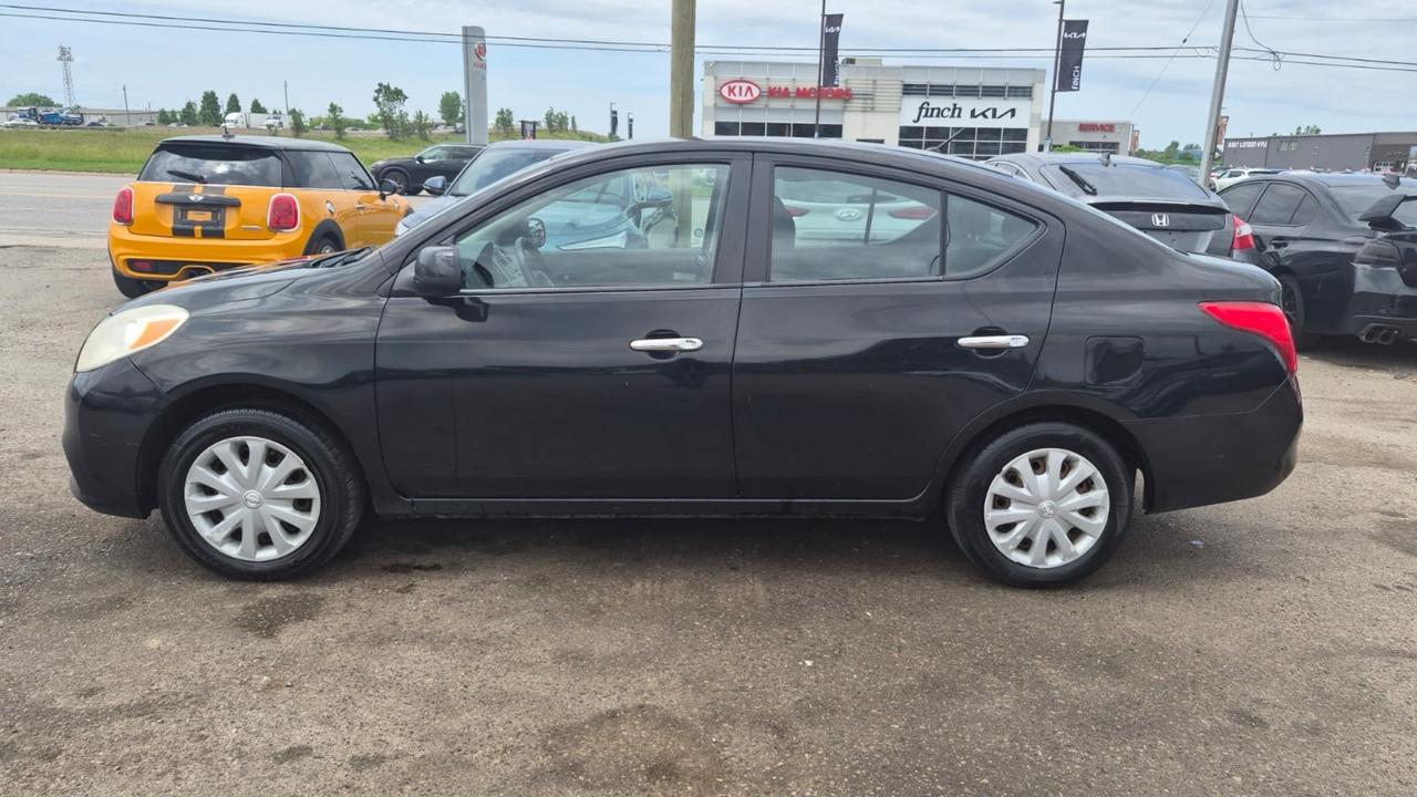 2012 Nissan Versa SV, MANUAL, SEDAN, GREAT ON FUEL, CERTIFIED Photo