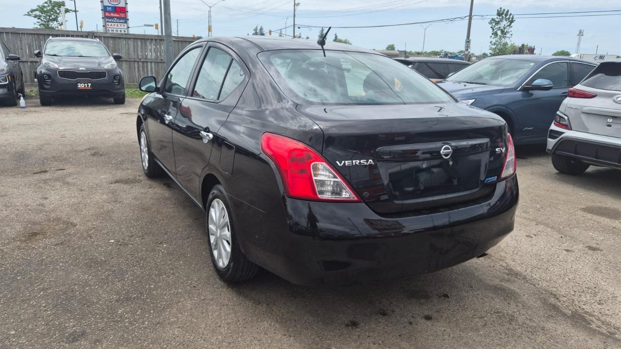 2012 Nissan Versa SV, MANUAL, SEDAN, GREAT ON FUEL, CERTIFIED Photo2