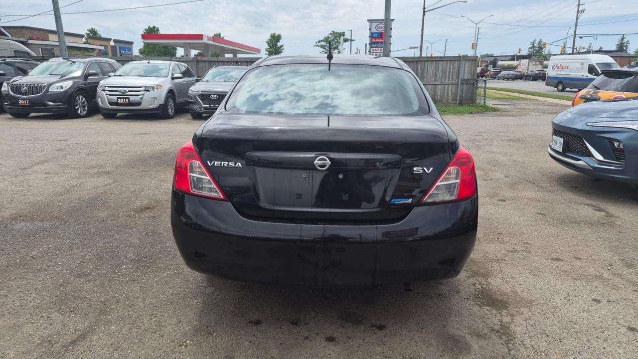 2012 Nissan Versa SV, MANUAL, SEDAN, GREAT ON FUEL, CERTIFIED Photo