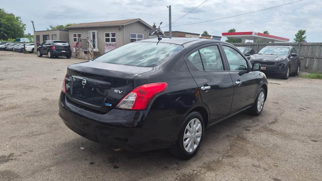 2012 Nissan Versa SV, MANUAL, SEDAN, GREAT ON FUEL, CERTIFIED Photo