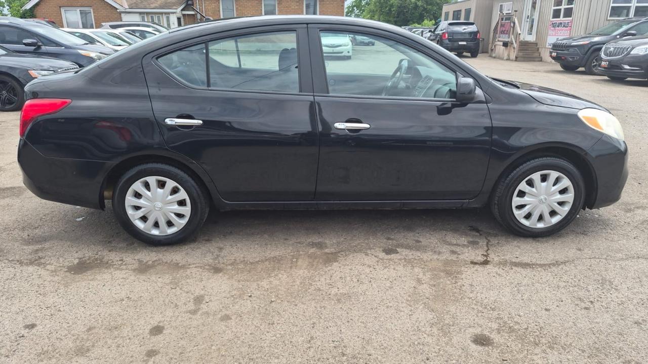 2012 Nissan Versa SV, MANUAL, SEDAN, GREAT ON FUEL, CERTIFIED Photo