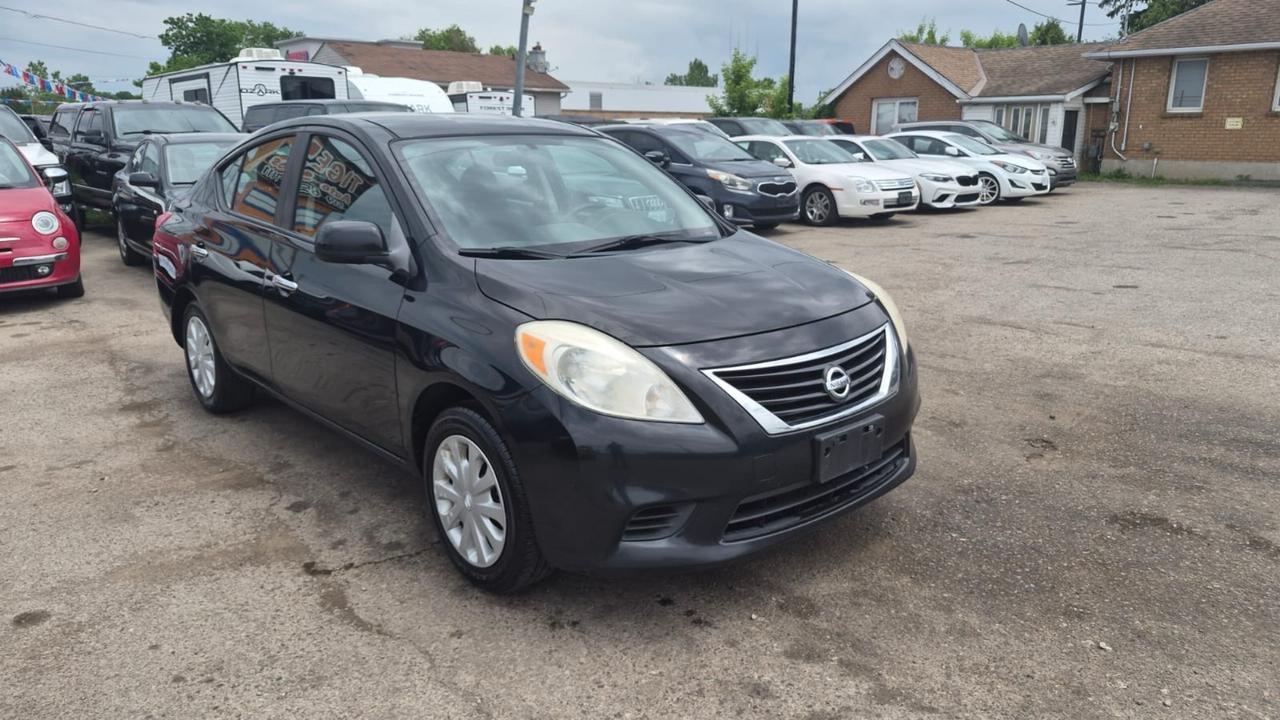 2012 Nissan Versa SV, MANUAL, SEDAN, GREAT ON FUEL, CERTIFIED Photo