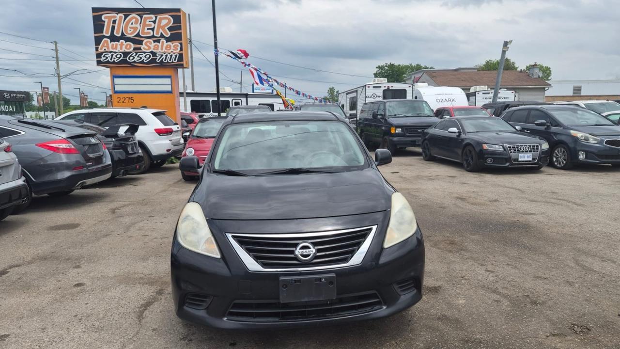 2012 Nissan Versa SV, MANUAL, SEDAN, GREAT ON FUEL, CERTIFIED Photo