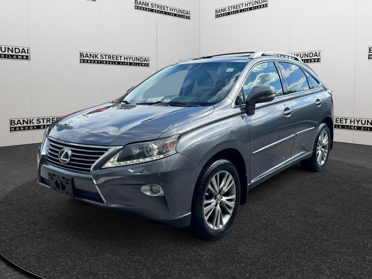 Experience the perfect blend of style and performance with this 2013 Lexus RX 350 AWD 4dr, presented in a sophisticated gray finish. Its All-Wheel Drive (AWD) system and automatic transmission promise excellent handling, making it an ideal choice for navigating both urban landscapes and winding country roads. The exterior showcases stylish alloy wheels and a sleek SUV silhouette. Inside, comfort meets elegance with power seats and windows, ensuring a pleasant journey regardless of the distance. Enjoy seamless connectivity with Bluetooth, and keep your travels entertaining with the convenience of satellite radio. Incorporating modern technology, this RX 350 includes keyless entry for a touch of convenience. Stay secure with advanced brake assist features, while maintaining peace of mind thanks to reliable cruise control and tailor-fit climate comfort through its air conditioning system. If youre seeking a luxurious yet practical ride that meets the demands of both family trips and solo city commutes, this Lexus RX 350 is tailor-made for you. Contact Bank Street Hyundai today to arrange your test drive and explore this remarkable vehicle in person.
