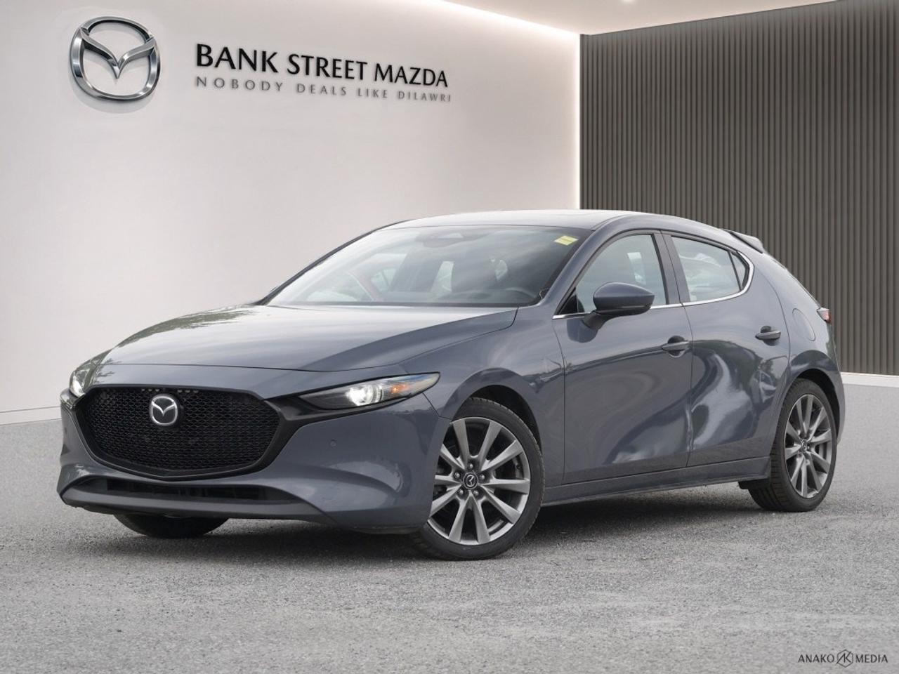 Experience the thrill of driving with the 2024 Mazda3 Sport GT, available in a stunning sedan silhouette with a forward-thinking front-wheel-drive system. Its automatic transmission ensures smooth handling, making every journey a delight. The exterior boasts eye-catching alloy wheels complemented by the sophisticated elegance of its design. Inside, enjoy the premium feel of leather seats and the convenience of power windows and power seats. The sunroof/moonroof offers a touch of luxury, letting in just the right amount of natural light. The 2024 Mazda3 Sport GT is brimming with technology and safety features to enhance your drive. It is equipped with a cutting-edge navigation system, smart device integration, and a heads-up display for easy access to vital information. Enjoy peace of mind with advanced safety features such as lane assist, brake assist, and parking sensors. The backup camera and keyless entry add another layer of convenience. Whether youre commuting to work or enjoying a weekend getaway, the Mazda3 Sport GTs heated seats, cruise control, and satellite radio will ensure you travel in comfort and style. This car is perfect for drivers who value performance, technology, and luxury without compromise. Visit Bank Street Mazda to learn more and take a test drive today!
