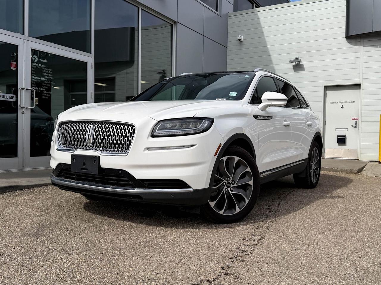 Discover luxury and advanced technology with this pre-owned 2021 Lincoln Nautilus Reserve AWD in stunning Pristine White Tri-Coat with a sleek Black Ebony interior. Powered by a fuel-efficient 2.0L I4 EcoBoost engine paired with an 8-speed SelectShift automatic transmission, this SUV delivers smooth performance and confident handling.Enjoy premium features like heated and ventilated leather-trimmed captain seats, Revel audio system with HD Radio, and a panoramic sunroof. Stay connected and secure with Phone as a Key, SYNC 4 with enhanced voice recognition, and Lincoln Co-Pilot360 Plus safety technology including Adaptive Cruise Control with Stop and Go, Enhanced Active Park Assist, and a 360-degree camera.With practical luxury touches like the Class II Trailer Tow Package, roof rack side rails, rear cargo management system, and heated rear seats, this Nautilus is perfect for both everyday driving and weekend adventures.Vehicle previously registered in Ontario and QuebecGo Mazda is a AMVIC licneced business