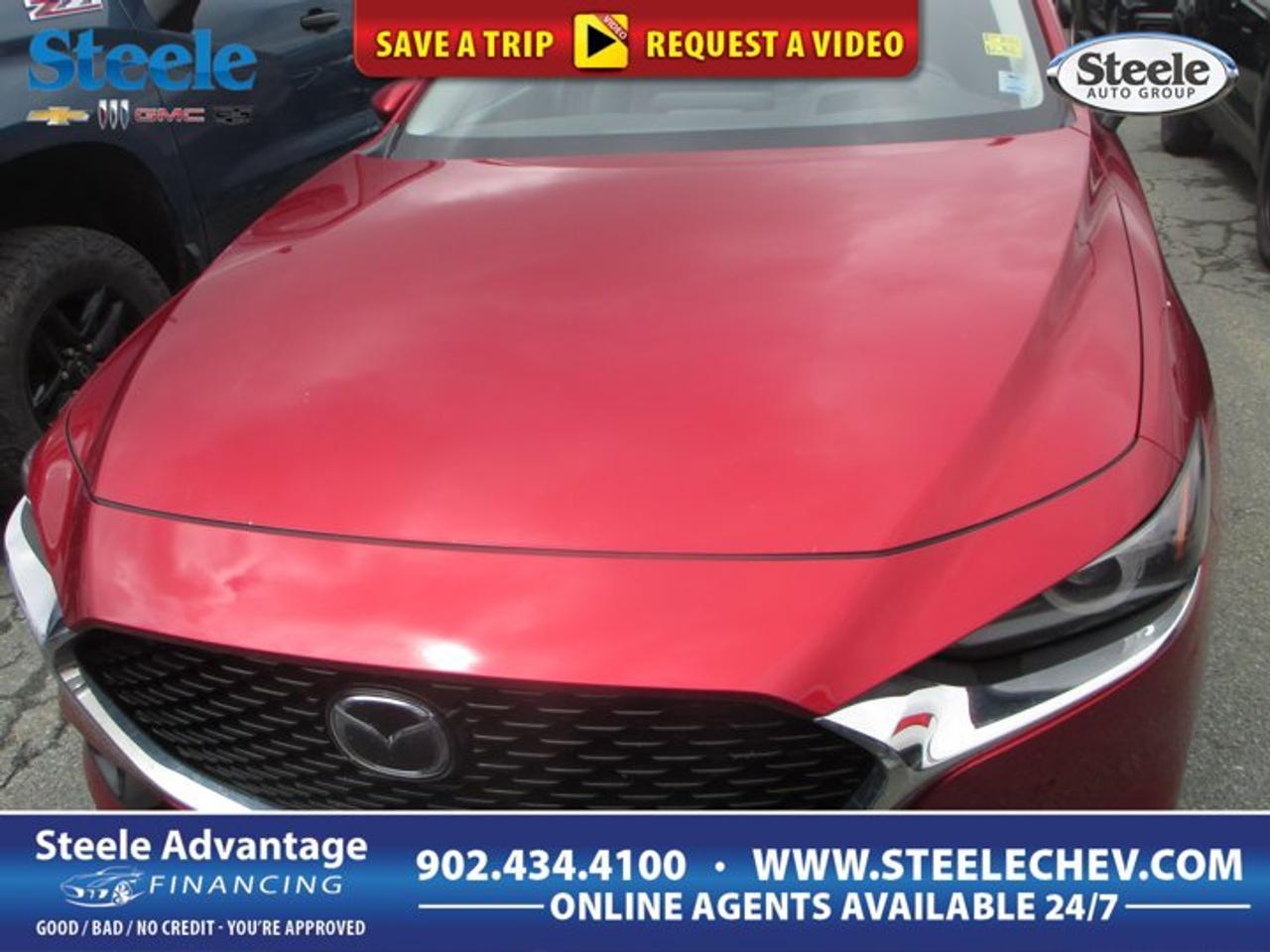 Finished in red and offered by Steele Chevrolet Buick GMC in Dartmouth, this used 2021 Mazda Mazda3 GT sedan brings together upscale design, confident all-wheel drive, and a refined driving character. Its 2.5L SKYACTIV-G DOHC 16-valve I4 engine pairs with an automatic transmission for smooth response in daily traffic and relaxed highway cruising.With 72,235 km on the odometer, this four-door Mazda3 GT still stands out for its premium feel and balanced road manners. The cabin layout is clean and driver-focused, while the compact sedan shape makes parking easy and city driving simple. For drivers who want style, control, and comfort in one smart package, this Mazda3 GT is a compelling choice.FEATURES OF THE Mazda3 GTStandard all-wheel drive for added confidence2.5L SKYACTIV-G four-cylinder gas engineAutomatic transmission for smooth everyday drivingFour-door sedan with refined road mannersADVANCED SAFETY FEATURESRearview camera helps with tight parkingAdvanced airbag system for occupant supportStability control helps maintain road composureTraction control aids grip in weatherThe 2021 Mazda Mazda3 GT is known for delivering a secure and composed drive, especially with all-wheel drive helping manage changing road conditions around Dartmouth and beyond. Its safety engineering supports confident travel, whether you are commuting through town, heading across the bridge, or setting out on a longer weekend drive.PERFORMANCE AND EFFICIENCY2.5L engine delivers smooth usable powerAutomatic transmission shifts with refined responseAll-wheel drive adds year-round confidenceBalanced handling supports comfortable daily drivingMazda has built a strong reputation for making cars that feel engaging without giving up comfort, and the Mazda3 GT reflects that well. The 2.5L engine offers solid passing power and smooth acceleration, while the automatic transmission keeps the drive easy in stop-and-go traffic. All-wheel drive adds extra assurance on wet, snowy, or uneven roads.COMFORT AND CONVENIENCEFour doors allow easy passenger accessSedan layout supports everyday practicalityDriver-focused cabin feels clean and modernComfortable ride quality suits longer tripsInside, the 2021 Mazda Mazda3 GT offers a mature and polished atmosphere. The controls are placed with the driver in mind, helping reduce distraction and making the cabin easy to use. The sedan body style also gives rear passengers practical access, while the overall ride remains composed enough for commuting, errands, and highway travel.TECHNOLOGY AND CONNECTIVITYClear driver information display supports awarenessUser-friendly controls simplify daily operationModern cabin design feels thoughtfully arrangedConvenient connectivity features enhance each driveThe Mazda3 GT is widely appreciated for its upscale approach to in-car technology. Its layout emphasizes ease of use over clutter, giving drivers a more natural connection to the vehicle. This helps make every trip feel organized and relaxed, whether you are navigating busy streets, listening to music, or managing calls on the move.CARGO SPACETrunk area suits daily essentials wellRear seat access adds practical flexibilitySedan proportions ease urban parking tasksCabin storage helps organize smaller itemsFor a compact sedan, the 2021 Mazda Mazda3 GT offers useful everyday practicality. The trunk is well suited for groceries, work bags, or weekend gear, and the four-door design makes loading passengers and smaller items simple. It is an ideal fit for drivers who want efficiency in size without giving up useful interior function.AWARDS & RECOGNITIONSTop Safety Pick, Insurance Institute for Highway Safety, 2021WHAT OTHER OWNERS LIKEConfident all-wheel drive in changing weatherUpscale interior feel for the classSmooth ride with responsive steering balanceAttractive styling with premium overall characterMany owners appreciate how the 2021 Mazda Mazda3 GT feels more refined than many compact sedans. It blends confident traction, quality design, and strong driving manners in a very complete package. If you want a used sedan that feels polished and rewarding every day, this red Mazda3 GT at Steele Chevrolet Buick GMC deserves a close look.This 2021 Mazda Mazda3 GTs VIN is: JM1BPBDL4M1325934 .