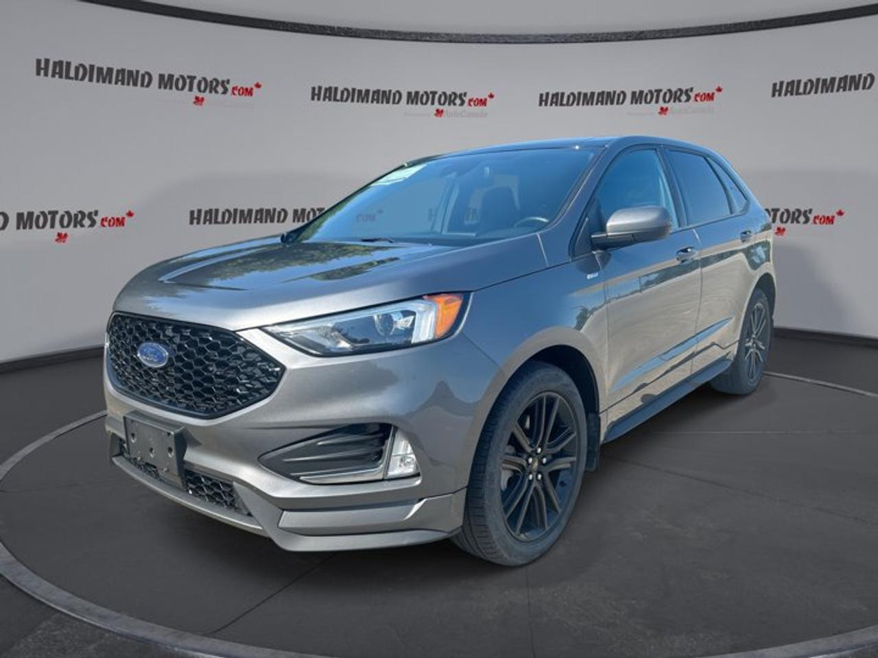 // ACCIDENT FREE!! //<br /><br />This 2024 Ford Edge ST Line AWD | No Accidents | Panoramic Sunroof | Heated Steering is a smart choice for drivers who want style, comfort, and everyday confidence. Finished in Grey with a Black interior, this used SUV offers a sporty look, four doors, and a well-equipped cabin built for Canadian driving.<br /><br />With 47,156 km on the odometer, this Ford Edge ST Line AWD | No Accidents | Panoramic Sunroof | Heated Steering delivers strong value and modern utility. Its 2.0-litre gas engine pairs with an 8-speed automatic transmission for smooth response, while all-wheel drive helps add control in changing road conditions.<br /><br />Sold by Haldimand Motors Ltd. in Cayuga, this Ford Edge ST Line AWD | No Accidents | Panoramic Sunroof | Heated Steering stands out with a panoramic sunroof, heated steering wheel, heated front seats, navigation, and a power liftgate. It is well suited for family travel, commuting, and weekend trips alike.<br /><br />FEATURES OF THE Edge ST Line AWD | No Accidents | Panoramic Sunroof | Heated Steering<br />   Panoramic sunroof brightens the whole cabin<br />   Heated steering wheel adds winter comfort<br />   All-wheel drive supports confident traction<br />   Sporty ST-Line appearance adds extra appeal<br /><br />ADVANCED SAFETY FEATURES<br />   Backup camera helps with tight parking<br />   Blind spot monitor adds lane confidence<br />   Lane departure warning supports safer travel<br />   Multiple airbags enhance occupant protection<br /><br />PERFORMANCE AND EFFICIENCY<br />   2.0-litre gas engine balances power efficiently<br />   8-speed automatic delivers smooth shifting<br />   All-wheel drive improves year-round traction<br />   Stability control supports composed road manners<br /><br />COMFORT AND CONVENIENCE<br />   Heated front seats for cold mornings<br />   Dual-zone climate control adds cabin comfort<br />   Remote starter helps pre-condition the cabin<br />   Power liftgate simplifies daily loading tasks<br /><br />TECHNONOLGY AND CONNECTIVITY<br />   Apple CarPlay keeps apps within reach<br />   Android Auto supports easy smartphone access<br />   Bluetooth integration enables hands-free communication<br />   Navigation system helps guide every trip<br /><br />CARGO SPACE<br />   Rear trunk access makes loading easier<br />   Power liftgate adds everyday convenience<br />   Four-door layout supports family-friendly practicality<br />   Flexible cargo area suits daily errands<br /><br />AWARDS & RECOGNITIONS<br />   Top Safety Pick, Insurance Institute for Highway Safety, 2024<br /><br />WHAT OTHER OWNERS LIKE<br />   Comfortable ride quality for daily driving<br />   User-friendly infotainment and smartphone connectivity<br />   Confident all-wheel drive in poor weather<br />   Spacious cabin with practical cargo room<br /><br />The cabin is designed to make each trip easy and enjoyable. Heated front seats, automatic climate control, dual-zone temperature settings, and an auto-dimming rearview mirror all help create a more relaxed drive. The panoramic sunroof brings in extra light and gives the interior a more open feel.<br /><br />Convenience is a major strength here. You also get push button start, power windows, power mirrors, heated mirrors, remote trunk release, cruise control, power steering, and steering wheel audio controls. The adjustable steering wheel and drivers seat lumbar support help you find a comfortable driving position with ease.<br /><br />This SUV also brings useful tech for modern life. Apple CarPlay, Android Auto, Bluetooth integration, satellite radio, WiFi hotspot capability, and GPS navigation help keep you connected on the move. LED headlamps and automatic headlights add clear visibility, while fog lights help in poor weather.<br /><br />Its road manners are composed and confident. The 2.0-litre engine offers a solid mix of efficiency and usable power, and the 8-speed automatic transmission keeps acceleration smooth. Performance tires and a limited slip differential help this Edge feel planted and capable in a wide range of driving conditions.<br /><br />This 2024 Ford Edge ST Line AWD | No Accidents | Panoramic Sunroof | Heated Steerings VIN is: 2FMPK4J93RBA21672.<br /><br />WHY CHOOSE US? <br /><br />Honest & Transparent Buying Experience: Weve been a trusted name in business since 1984.<br /><br />STRAIGHTFORWARD PRICING:<br />Our Advertised Price Includes:<br />>>Safety Certification (No separate fee!)<br />>>30-Day 100% Mechanical Warranty<br />>>FREE Carfax History Report.<br />>>No upcharge for paying cash.<br />(Prices Exclude HST and Licensing Fees only.)<br /><br />>>Browse 300+ vehicles all in ONE LOCATION<br /><br />EASY FINANCING: Great rates & open loans<br /><br />WE BUY CARS: Get Top Dollar for your trade-in, or sell us your vehicle for CASH! Even if you dont buy from us!<br /><br />STOP BY TODAY<br />Treat yourself - stop by Haldimand Motors Ltd. located at 42 Talbot St E, Cayuga, ON N0A 1E0 to make this car yours today!<br /><br />https://www.haldimandmotors.com/used/stock-460638.html