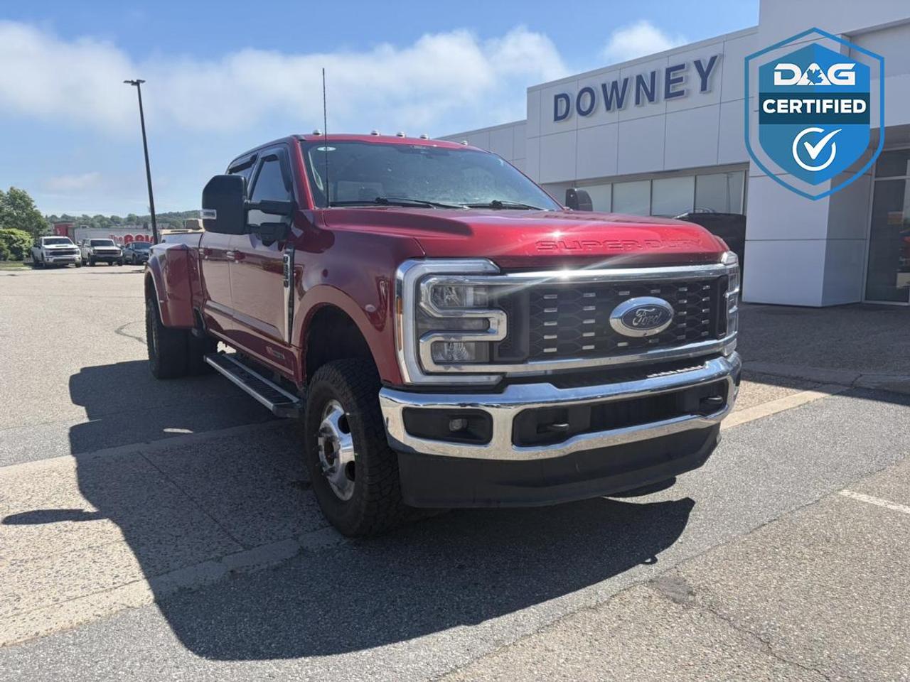 500 horsepower, 1,200 lb-ft of torque, and the legendary High-Output 6.7L Power Stroke Turbo Diesel V8 make this 2024 Ford F-350 Lariat DRW an absolute powerhouse. Built for serious towing, hauling, and commercial-grade capability, this dual rear wheel Super Duty is engineered to handle the toughest jobs while delivering premium comfort and advanced technology.

Under the hood sits Fords most powerful diesel engine ever offered in a Super Duty, producing an incredible 500 horsepower and a massive 1,200 lb-ft of torque. Paired with the heavy-duty TorqShift 10-speed automatic transmission and a robust 4WD system, this F-350 delivers exceptional towing confidence, effortless highway performance, and the durability demanded by hardworking truck owners. Whether youre hauling equipment, towing a large fifth-wheel trailer, or managing a commercial fleet, this truck is built to perform at the highest level.

The dual rear wheel configuration dramatically enhances towing stability and payload capability, while the 8-foot box provides outstanding cargo-carrying versatility. Combined with Fords high-strength fully boxed steel frame and military-grade aluminum-alloy body, this Super Duty is designed to stand up to years of demanding use.

The Lariat trim brings premium comfort and refinement to this heavy-duty workhorse. Inside, youll find leather-trimmed seating, heated and ventilated front seats, a heated steering wheel, power-adjustable front seats with memory settings, dual-zone automatic climate control, remote start, push-button start, and a spacious Crew Cab interior that provides exceptional comfort for both drivers and passengers.

Technology is equally impressive. The advanced SYNC 4 infotainment system features a large touchscreen display with wireless Apple CarPlay and Android Auto compatibility, Bluetooth connectivity, voice-activated controls, navigation capability, multiple USB ports, and a premium digital instrument cluster. Fords Pro Trailer technologies help simplify towing, making even the largest trailers easier to manage.

Safety and driver assistance features include Blind Spot Information System with Trailer Coverage, Pre-Collision Assist with Automatic Emergency Braking, Lane Keeping System, Adaptive Cruise Control, 360-Degree Camera System, Rear View Camera, Reverse Sensing System, Trailer Reverse Guidance, and numerous advanced towing assistance technologies designed to provide maximum confidence behind the wheel.

The exterior commands attention with chrome accents, LED lighting, large alloy wheels, power telescoping trailer tow mirrors, and the unmistakable presence of a Super Duty dually. This truck isnt simply built to do the job, its built to make every job easier.

If youre looking for one of the most capable pickups available today, this 2024 Ford F-350 Lariat DRW offers unmatched diesel power, exceptional towing capability, luxury-level comfort, and the advanced technology todays truck buyers demand.

Why buy from Downey Ford? GREAT QUESTION!! Heres why: Market Value Pricing provides the most competitive prices on all our pre-owned vehicles, all the time! Downey Ford is the largest volume Ford dealership in the Maritimes. Every Pre-Owned Vehicle comes with New Wipers, New In-Cabin Filter, and New Engine Air Filter. Plus Plus Plus.

Reconditioning our pre-owned inventory is a source of pride for us! A basic motor vehicle inspection and a quick wash just isnt good enough for our customers. We complete an extremely thorough process, both mechanically and cosmetically, before it meets our standards.

Our mechanical inspection covers 100+++ components including the Engine, Electrical System, Suspension, Transmission, Brakes, Frame, and regular maintenance servicing. Our cosmetic reconditioning is elite and includes Shampooing of Carpet, Acid Wash of Rims, Dressing of Tires, Engine Detail, and a Multi-Stage Polish.

Here are some other extras we are happy to offer at no charge to you: Vehicle History Report, Accident / Damage Report, Stolen Vehicle Report, Lien Search Report, Credit Report Review and Counseling, Free Trade-In Appraisals, Relaxed Low Pressure Sales Experience, Finance Pre-Approval Service, Service Departments covering all of Southern New Brunswick, Delivery Services to all of Canada, Multiple Chartered Bank Financing Sources, Multiple Vehicle Protection Products available, Multiple Loan Protection Products available, and a Pet-Friendly Facility. Feel free to bring Bingo with you.

We want to EARN your business and hope to speak with you soon. Our knowledgeable and friendly sales staff are here to ensure a seamless and enjoyable car-buying experience. Call us at 506-632-6000 to book your test drive today and discover why Downey Ford is the trusted choice for so many.
