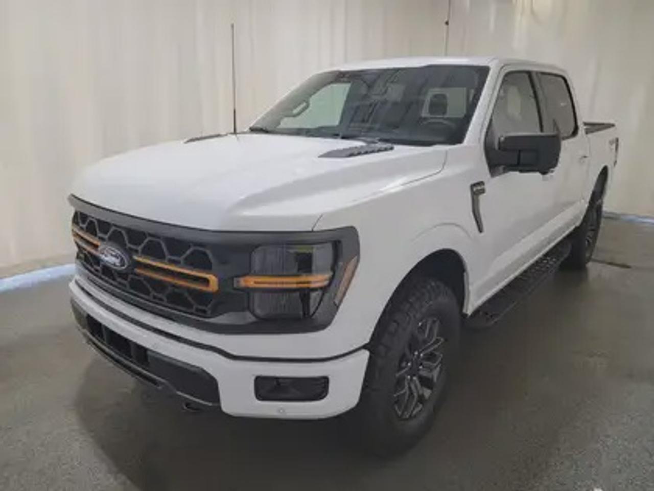 The all-new 2026 Ford F-150 Tremor 401A looks absolutely stunning in Oxford White. This pickup comes with the 3.5L EcoBoost® engine, delivering an impressive 400 horsepower and 500 lb-ft of torque. With EcoBoost® technology and a 10-speed automatic transmission, this truck achieves a highway/city fuel economy of 12.9L/100km (22 miles per gallon) combined highway/city. 

Key Features:
Selectable Drive Modes
18 Alloy W/ Dark Matte Finish Wheels
Heated Front Seats
Ford Co-Pilot 360 Assist 2.0
Adaptive Cruise Control
Lane Centering
Evasive Steering Assist
Front Parking Sensors
Pro Trailer Backup Assist
Pro Trailer Hitch Assist
BlueCruise
8 Speaker B&O Sound System
Hill Descent Control
Remote Start System
Engine Block Heater
Twin Panel Moonroof

This vehicle comes with the All-Weather Packageready to take on any season!Snow, rain, mud, or sunshinethis vehicle is built for it all! The All-Weather Package adds extra protection where it matters most, with premium mud flaps to shield your paint from road debris, all-weather floor mats to protect your interior from lifes messes, and Xpel paint protection to help guard against those infuriating rock chips. Drive with confidence, knowing your investment is protected from Reginas elements.

Bennett Dunlop Ford, proudly serving Regina for over 40 years, is conveniently located at 770 Broad Street. With over 3,500 Google reviews, our reputation reflects our commitment to providing a fast, easy, and enjoyable vehicle-buying experience. We eliminate the hassle with no admin or documentation fees, transparent upfront pricing that lets you shop with total confidence. But were more than just a dealershipwere driven to make a difference by supporting local community initiatives and events that matter to you. Visit Bennett Dunlop Ford today and experience why were Reginas trusted choice for quality vehicles, exceptional service, and a genuine commitment to driving change in our community!