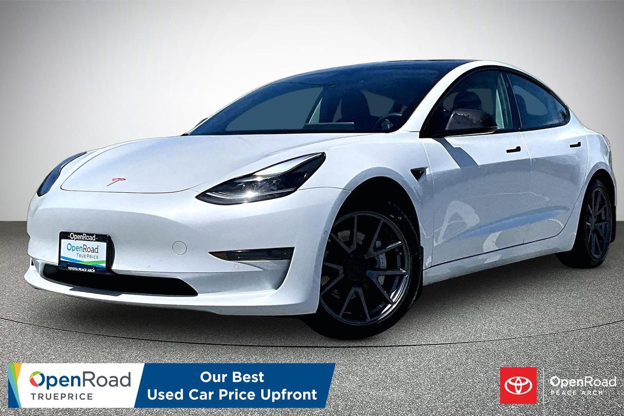 The 2021 Tesla Model 3 Standard Range Plus is an all-electric sedan that combines efficiency, technology, and performance. It features rear-wheel drive, quick acceleration, and an estimated driving range of approximately 423 kilometres. The minimalist cabin includes a 15-inch touchscreen controlling most vehicle functions, navigation, media, and climate settings. Standard features include Autopilot driver-assistance technology, heated front seats, a premium audio system, keyless entry, over-the-air software updates, and smartphone integration through the Tesla app. The Model 3 also offers strong safety ratings, a spacious interior, front and rear cargo storage areas, and a smooth, quiet driving experience.  Have confidence with your OpenRoad purchase! Every OpenRoad Certified Pre-Owned vehicle comes fully reconditioned and complete with a comprehensive 153 point mechanical inspection, a CarFax history & lien report, a 3-Day Money Back Guarantee, a 30-Day/2,000 kms Exchange Policy, a 90-Day/5,000 kms Powertrain Warranty, guaranteed clear title, and membership to our exclusive Club OpenRoad! As a proud member of the OpenRoad Auto Group, a trusted name since 2000 serving the Lower mainland (including White Rock, Surrey, Langley, Maple Ridge, Delta, Richmond, Mission and beyond) with outstanding Toyota vehicles, Toyota parts, and Toyota service since 1966! OpenRoad Toyota Peace Arch is a &ldquo;True Price&rdquo; dealer, meaning no inflated prices, and no need for back and forth haggling! We use up to the minute technology offering LIVE MARKET VALUE PRICING to ensure you are receiving the most competitive price possible on all of our Pre-Owned vehicles!  All advertised vehicle prices do not include our $699 documentation fee.
