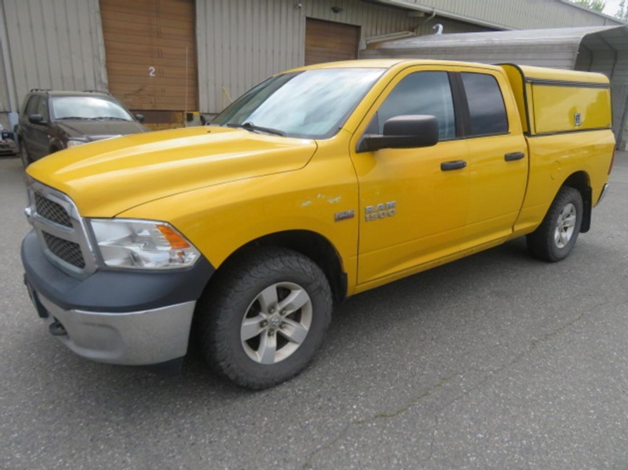 2015 RAM 1500 Quad Cab 4WD With Work Canopy, 5.7L, 8 cylinder, 4 door, automatic, 4WD, 4-Wheel ABS, power windows, yellow exterior, gray interior. This item is currently OFFSITE. You must register an appointment with our office to schedule an offsite viewing. Appointments must be made a minimum of one business day in advance (and as defined by the days that Repo.com is open for business) before your appointment can be scheduled and confirmed. We may, at our own discretion, instead opt to transport smaller items to Repo.coms main yard for viewing purposes.  $16,240.00 plus $375 processing fee, $16,615.00 total payment obligation before taxes.   Listing report, warranty, contract commitment cancellation fee, financing available on approved credit (some limitations and exceptions may apply). All above specifications and information is considered to be accurate but is not guaranteed and no opinion or advice is given as to whether this item should be purchased. We do not allow test drives due to theft, fraud, acts of vandalism and undetectable impaired driving. Instead we provide the following benefits: Complimentary Warranty (with options to extend), Limited Money Back Satisfaction Guarantee on Fully Completed Contracts, Contract Commitment Cancellation, and an Open-Ended Sell-Back Option. Ask seller for details or call 604-522-REPO(7376) to confirm listing availability.