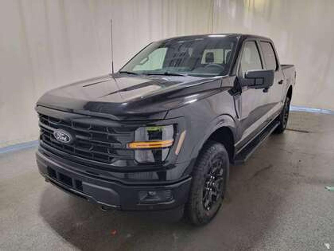 The all-new 2026 Ford F-150 XLT 302A is a statement of style in Agate Black Metallic. Powered by the 3.5L V6 engine, it delivers 400 horsepower and 500 lb-ft of torque, paired with a 10-speed automatic transmission. This truck achieves an impressive, combined fuel economy of 12.3 L/100 km (23 miles per gallon).

Key Features:
12 LCD Captivity Touchscreen
Electronic Power-Assist Steering
Dual-Zone Electronic Auto Temp Control
Cruise Control
Power Windows
AdvanceTrac® With Roll Stability Control
Perimeter Alarm
Ford Co-Pilot360
Lane Keeping System
Rear View Camera
Rear Parking Sensors
Reverse Park Assist
Class IV Trailer Hitch
Power Drivers Seat
Remote Start
SYNC®4
Apple Car Play
18 All Terrain Tires
Bluetooth Connectivity
XLT Black Appearance Package
Engine Block Heater
FX4 Off Road Package

This vehicle comes with the All-Weather Packageready to take on any season! Snow, rain, mud, or sunshinethis vehicle is built for it all! The All-Weather Package adds extra protection where it matters most, with premium mud flaps to shield your paint from road debris, all-weather floor mats to protect your interior from lifes messes, and Xpel paint protection to help guard against those infuriating rock chips. Drive with confidence, knowing your investment is protected from Regina's elements.

Bennett Dunlop Ford, proudly serving Regina for over 40 years, is conveniently located at 770 Broad Street. With over 3,500 Google reviews, our reputation reflects our commitment to providing a fast, easy, and enjoyable vehicle-buying experience. We eliminate the hassle with no admin or documentation fees, transparent upfront pricing that lets you shop with total confidence. But were more than just a dealershipwere driven to make a difference by supporting local community initiatives and events that matter to you. Visit Bennett Dunlop Ford today and experience why were Reginas trusted choice for quality vehicles, exceptional service, and a genuine commitment to driving change in our community!