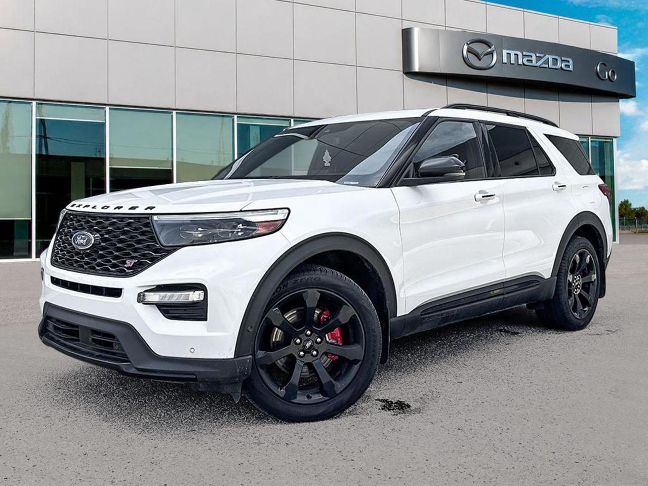 Experience power and luxury with this pre-owned 2021 Ford Explorer ST 4WD in stunning Star White Metallic Tri-coat with sleek black leather-trimmed seats. Powered by a robust 3.0L EcoBoost V6 and paired with a smooth 10-speed automatic transmission, this Explorer offers sport ride suspension, all-wheel drive, and advanced towing capabilities.Enjoy premium features like the Twin Panel Moonroof, B&O Sound System by Bang & Olufsen, leather heated and ventilated sport captains chairs with multicontour seats, and a 10.1 touchscreen with SYNC 3 technology. The Premium Technology Package adds driver-assist and safety features, including lane departure prevention, blind spot warning, and a full suite of airbags.With 20 machined-aluminum wheels, red painted brake calipers, and the dynamic ST Street Pack, this SUV blends athletic style with capability. From family road trips to city cruising, the Ford Explorer ST delivers an exceptional driving experience with comfort, connectivity, and confidence.Schedule a test drive today and make this versatile and powerful Explorer yours!Go Mazda is an AMVIC licenced businessClean CarFax