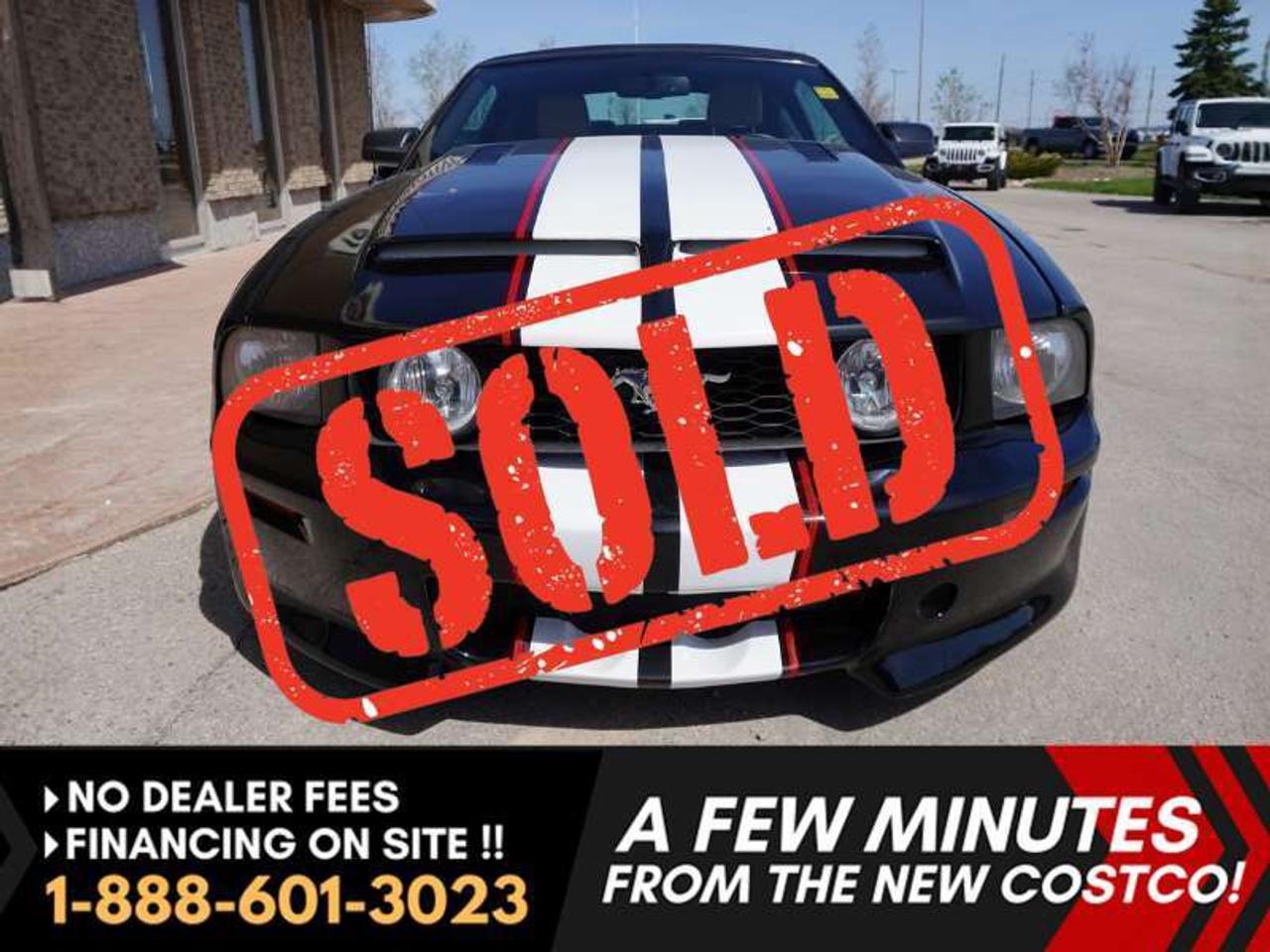 *** Dealer arranged financing on site! Quick, Simple,  no calls or waiting on bank appointments required!! Drive away today ***   NO ADMINISTRATION FEES!!

5TH GEN 2007 Ford Mustang Convertible -- RWD --  DUAL RACING STRIPES  --  Ground effects package!!! --   Rear spoiler  --  Hood Scoop -- Custom LED Dash lights -- Power Black Soft Top -- Rear glass window with defrost -- Power windows and doors -- Leather seats -- Wood Grain center console and accents  --  Up-graded font and rear headlights  --   Stereo with AM/FM and CD Player.

Shelby look alike.  A British Columbia sports car with no winter Winnipeg driven roads. Summer fun is just around the corner, this is the head turner.  Sharp black exterior. White and red dual stripes racing over the hood, decklid, and wing. Beige leather interior with rich wood grain accents.  Cowl induction hood, side hidden aftermarket exhaust, full molded bumper and fender kit, with the added light bar.  Tons of love and money went into creating this mustang.  Extremely low KMS with only 172,000 original kms.    

Good history. Serviced recently. An iconic American muscle car that is ready to be enjoyed!    

Features
- 4.0L V6 Gas engine
- 5-Speed Automatic
- Light bar/styling bar
- Cruise control
- Hood scoop
- 2- Door
- Leather Seats
- Passenger Airbag
- Driver Airbag
- Power Top
- Spoiler
- Power Mirrors
- Air conditioned
- Power Locks
- Rear Defrost
- Power driver seat
- Power Windows
- AM/FM Radio
- CD Player
- Traction control
- Tilt steering wheel

Comes with a Manitoba Safety Certification, and we have many Extended Powertrain warranties available on your vehicle purchase up to 10-year coverage (on eligible vehicles see dealer for details). Financing on site with Zero down financing OAC. Trades accepted. View at Winnipeg West Automotive Group, 5195 Portage Ave. (only a couple of minutes past the new Costco) Dealer permit # 6007, This Car is located in Winnipeg Manitoba,  however we can have it shipped anywhere in North America relatively inexpensively.