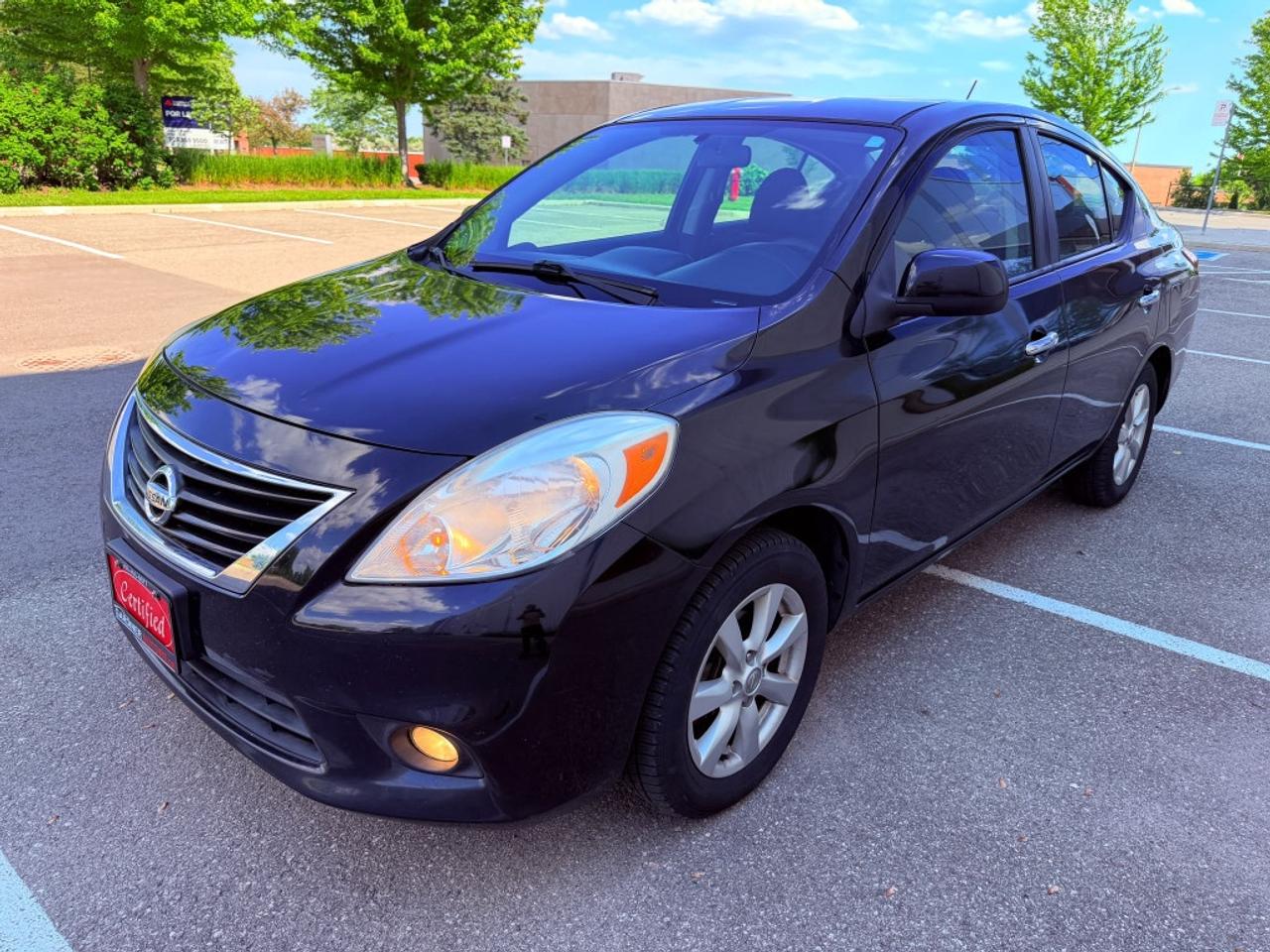 2012 Nissan Versa 1.6 S 4dr Sedan (1.6L 4cyl 5M) Photo