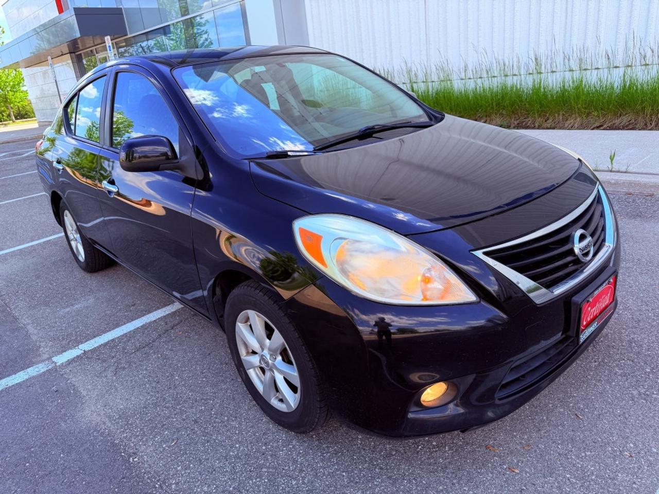 2012 Nissan Versa 1.6 S 4dr Sedan (1.6L 4cyl 5M) Photo